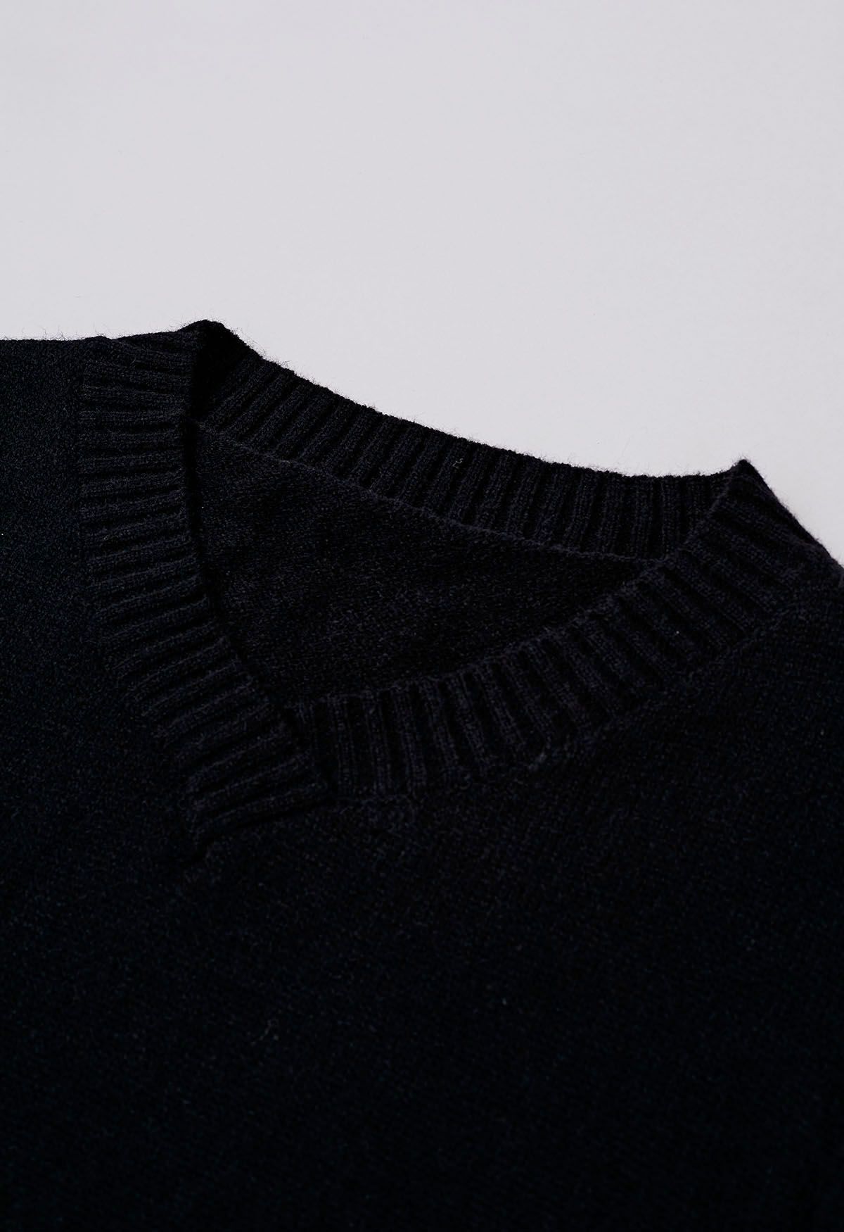 Pull en tricot ample à épaules tombantes et fente latérale en noir