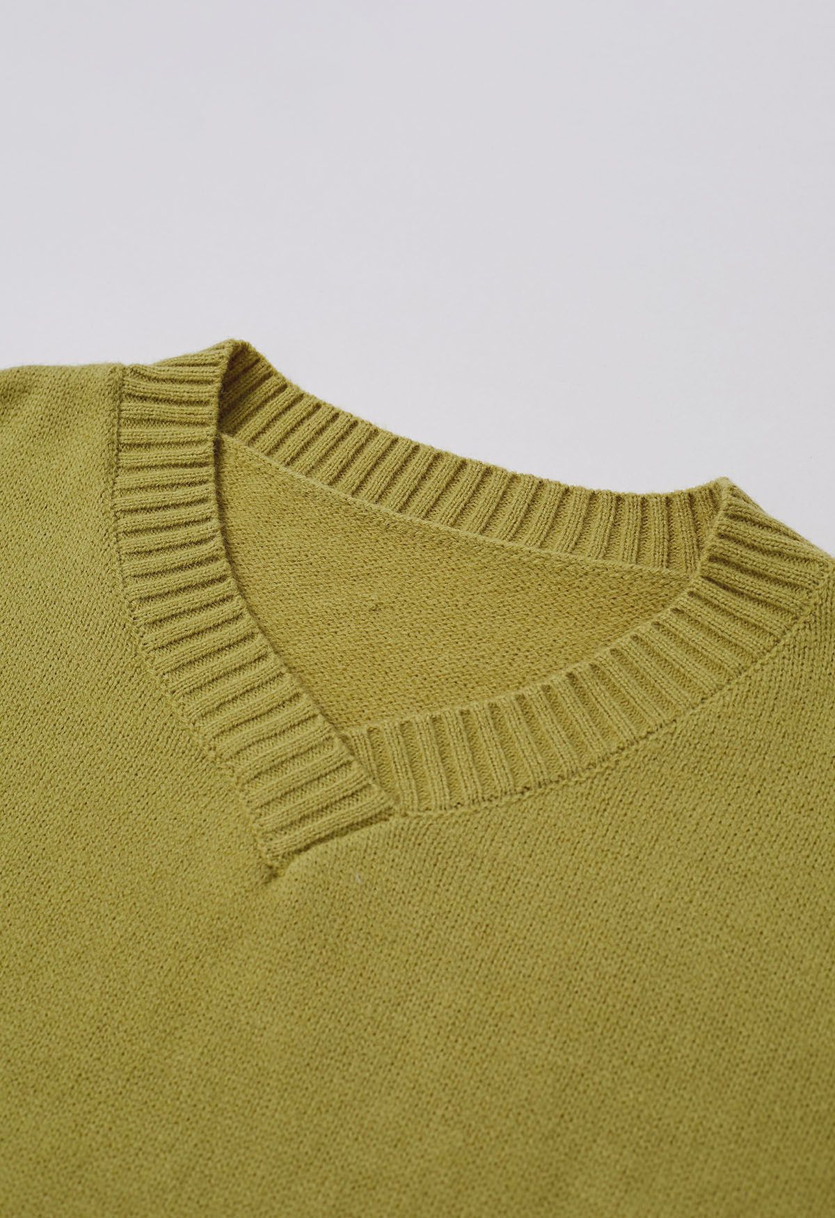 Pull en tricot ample à épaules tombantes et fente latérale en citron vert