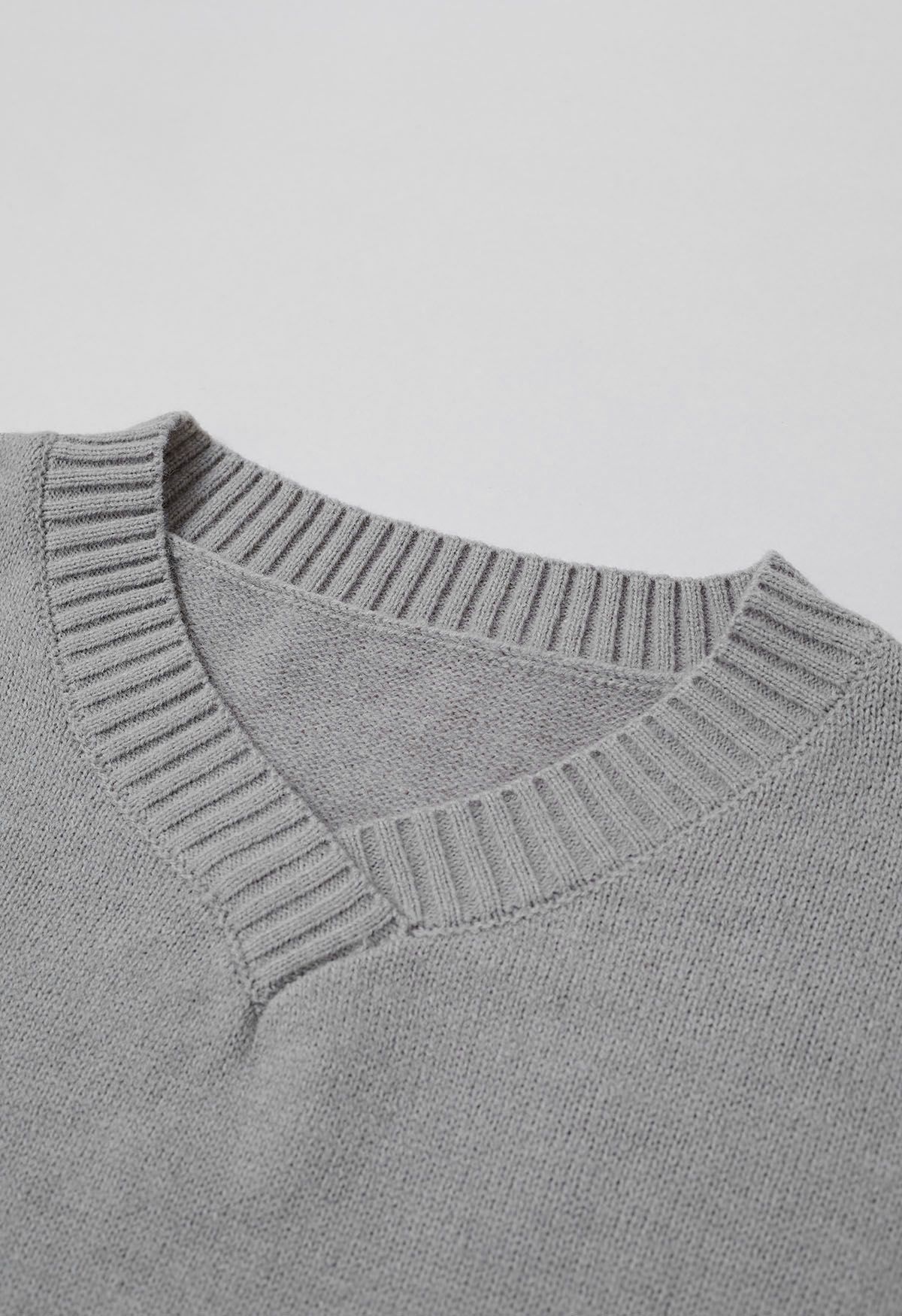 Pull en tricot ample à épaules tombantes et fente latérale en gris