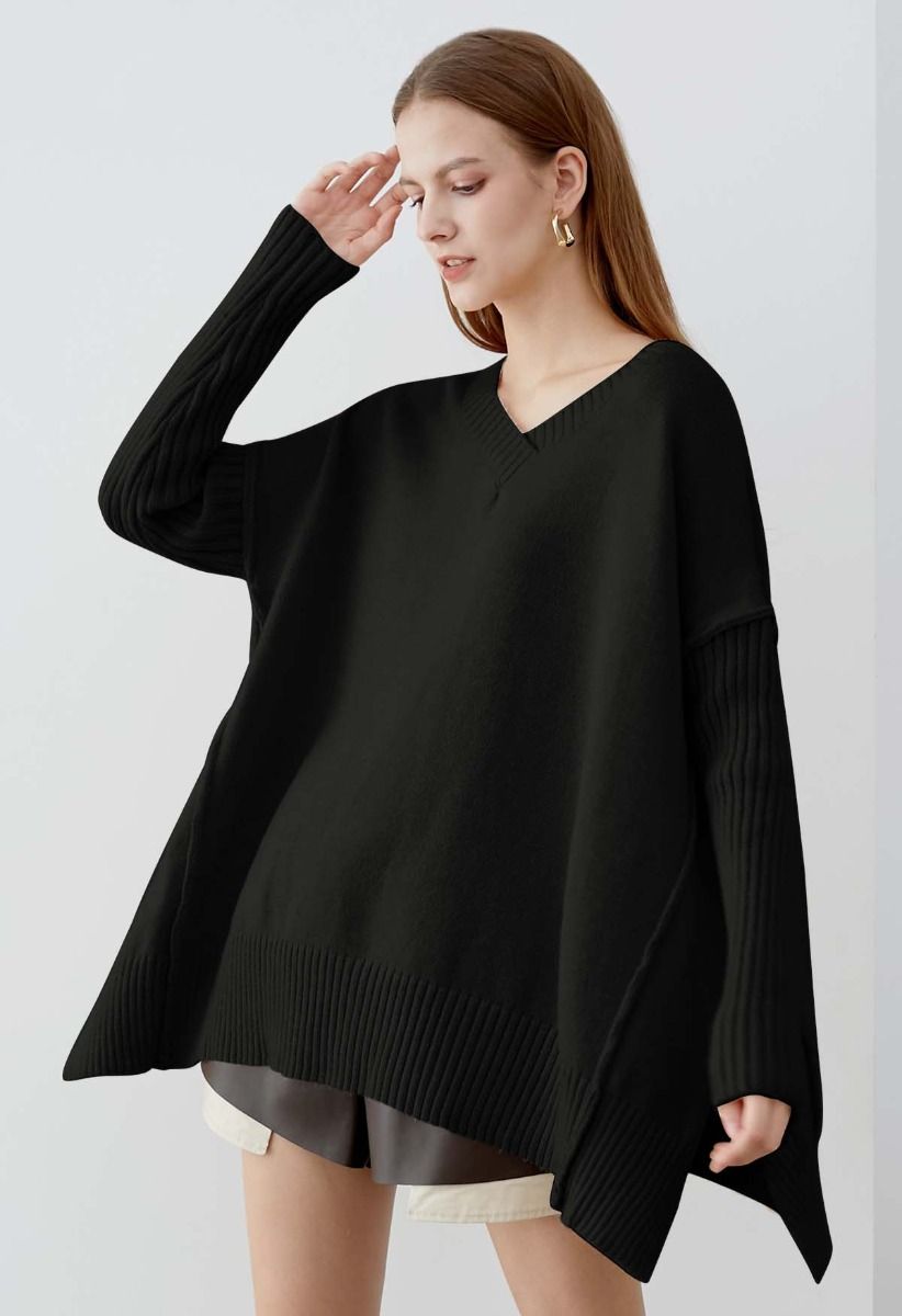 Pull en tricot ample à épaules tombantes et fente latérale en noir