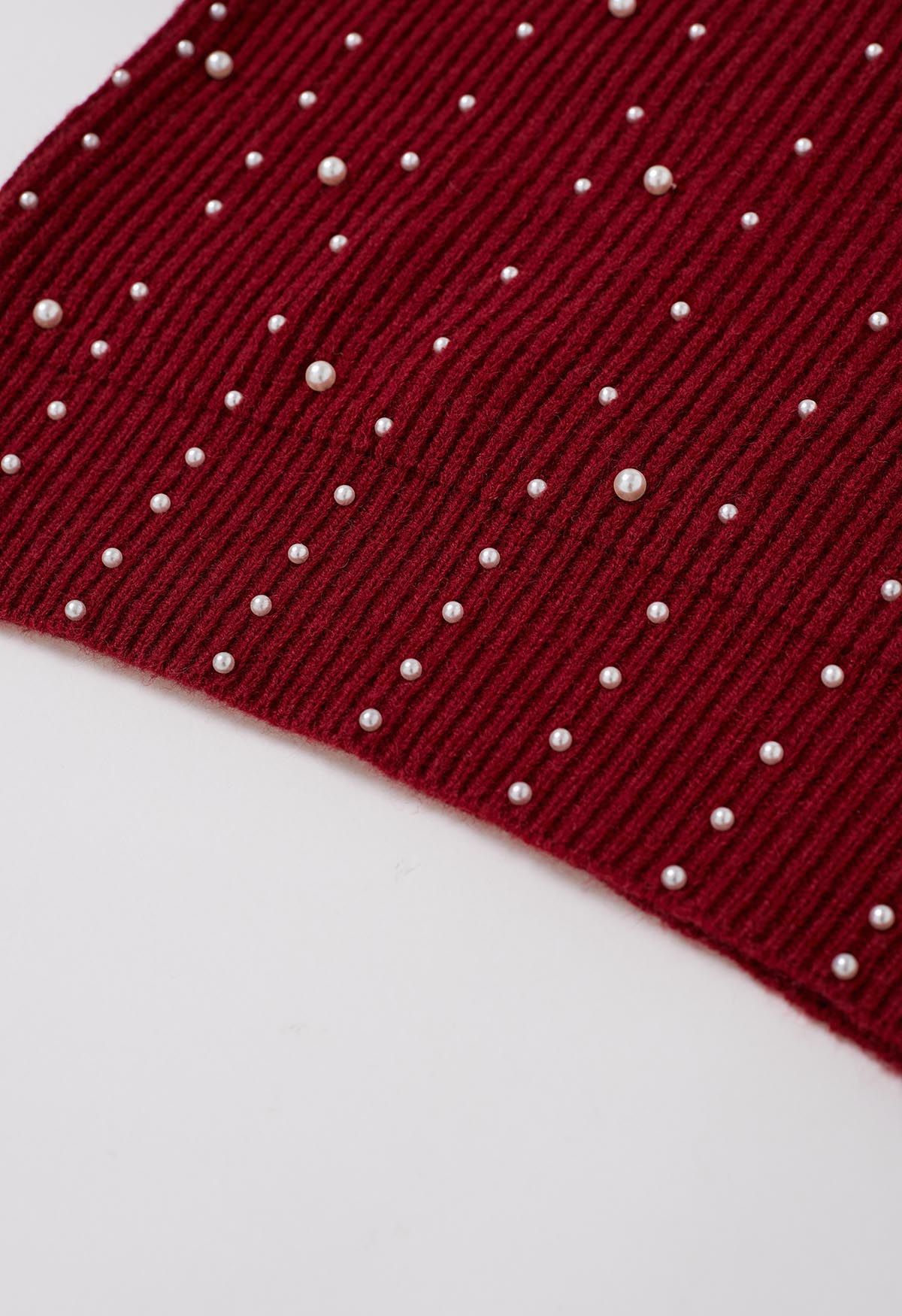 Pull en tricot à manches bouffantes orné de perles en rouge