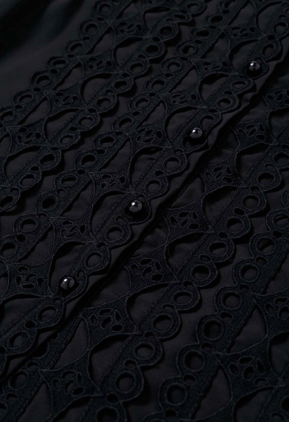 Chemise boutonnée à manches bulles et découpes exquises en noir
