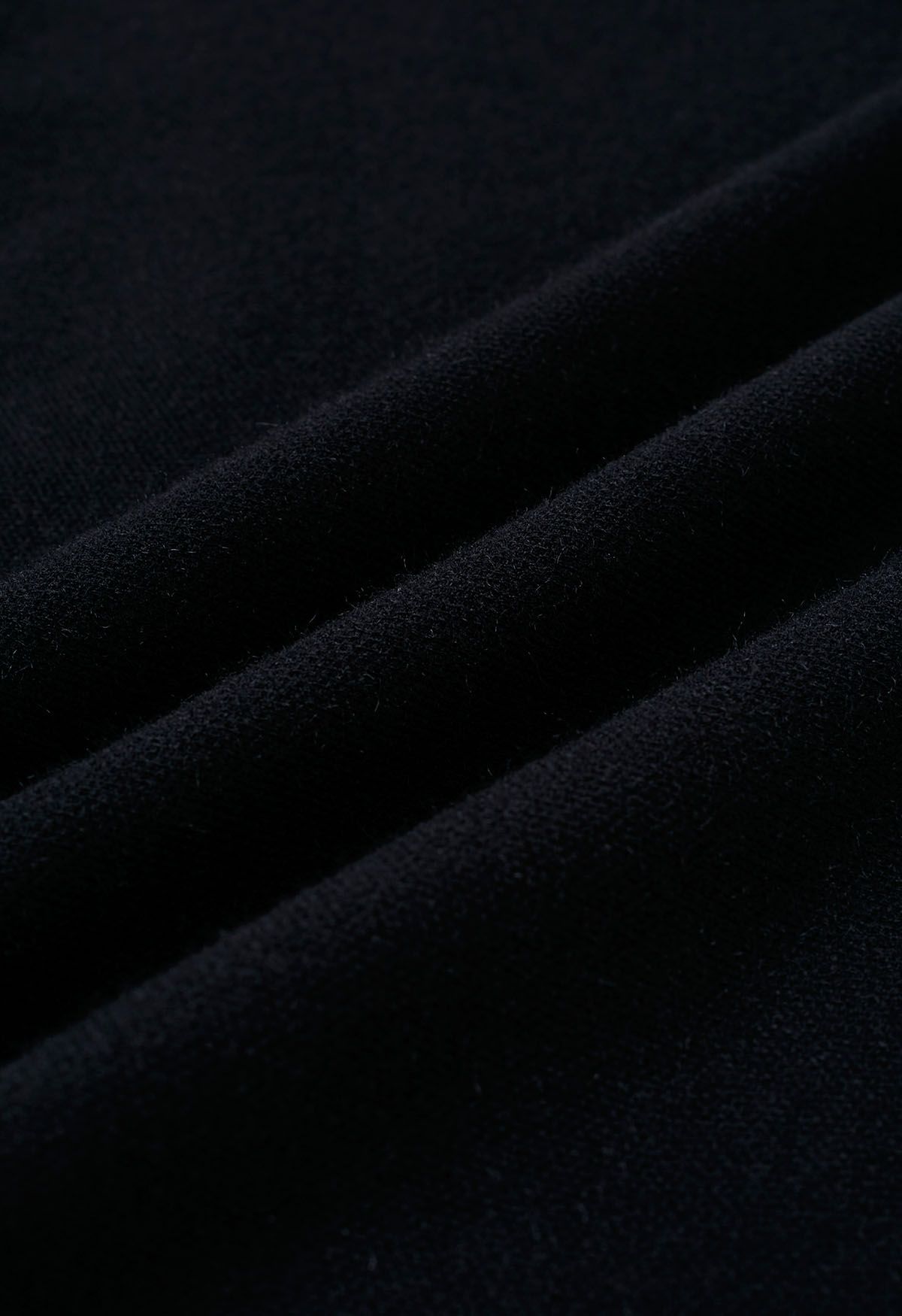 Poncho en tricot à ourlet fendu et manches en fausse fourrure, noir