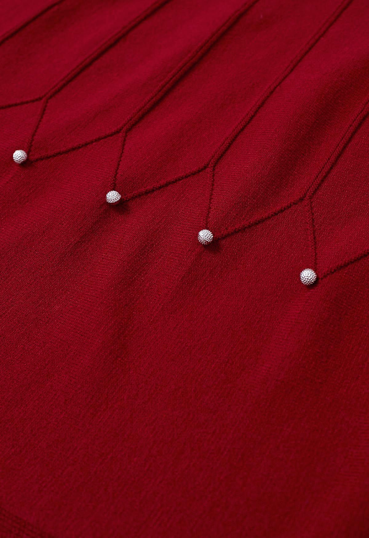 Jupe mi-longue en tricot à coutures ornées de perles argentées en rouge