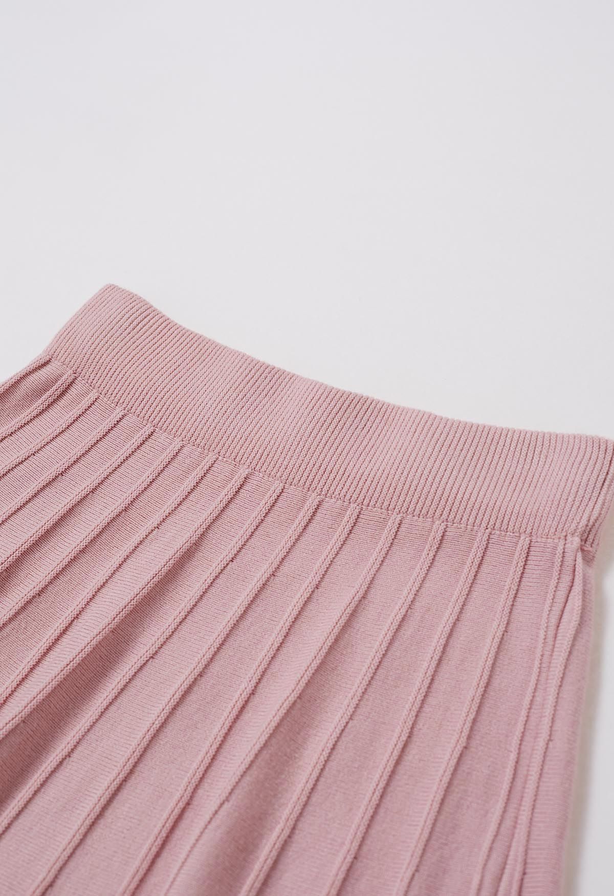 Jupe mi-longue en tricot à coutures ornées de perles argentées en rose