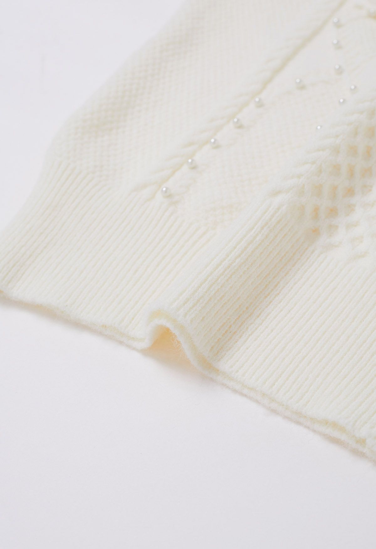 Pull en tricot nacré à fleurs 3D en ivoire