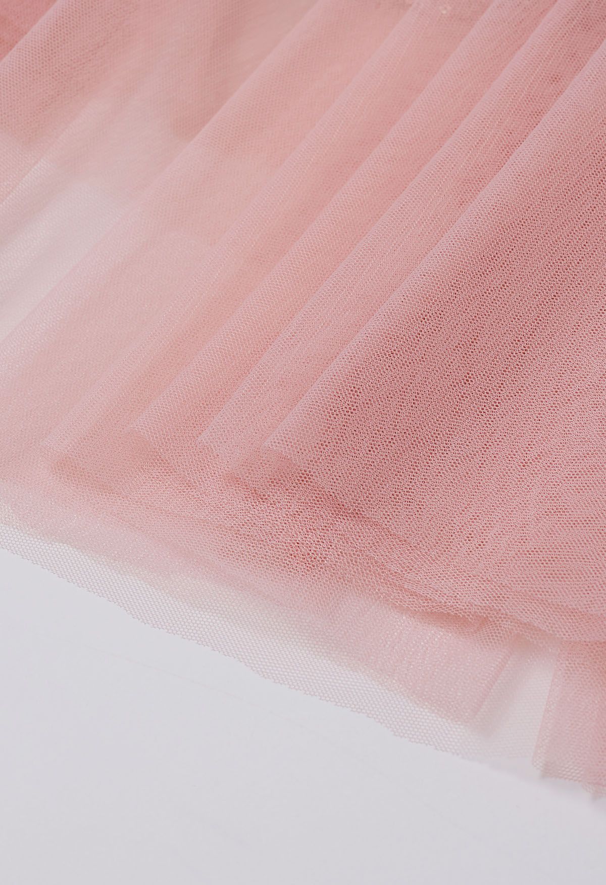 Ravissante jupe mi-longue en tulle et maille à sequins en rose