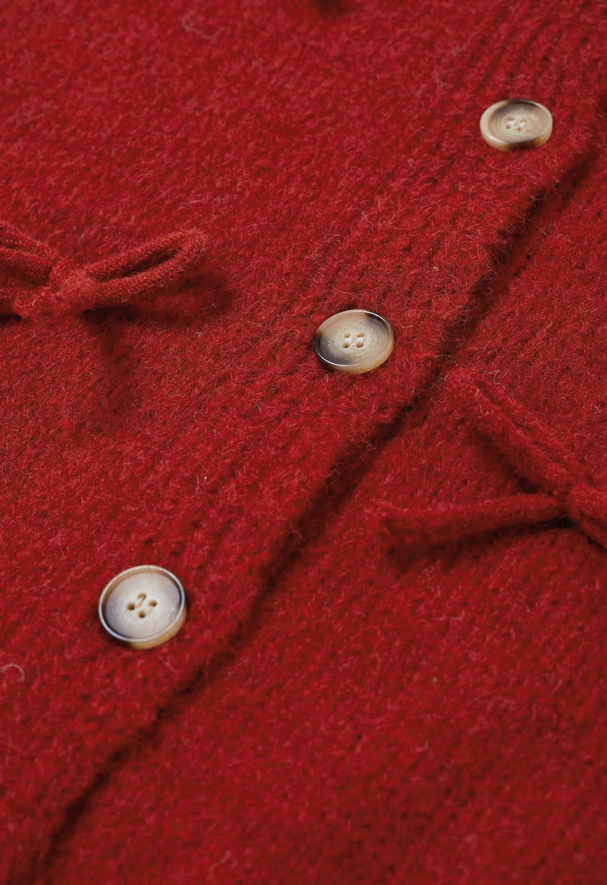 Adorable cardigan en tricot boutonné avec nœud papillon en rouge