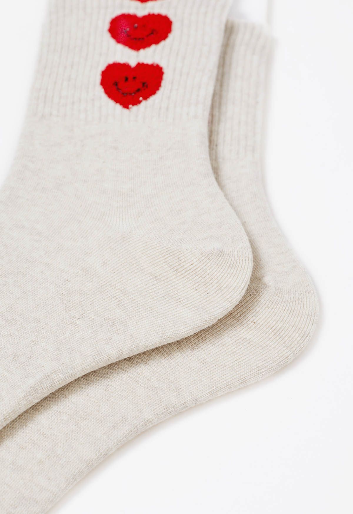 Chaussettes en coton avec visage souriant et cœur