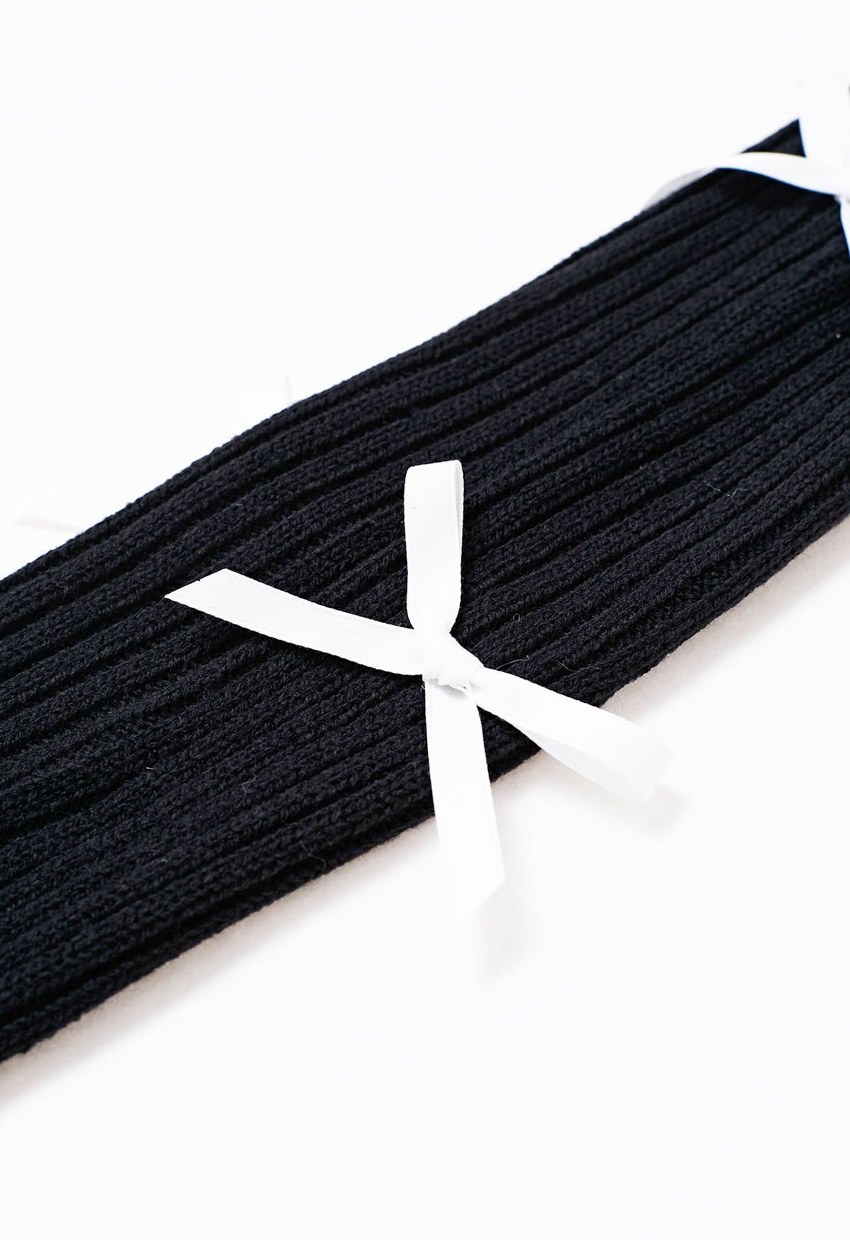 Jambières en tricot à décor de nœud papillon en noir