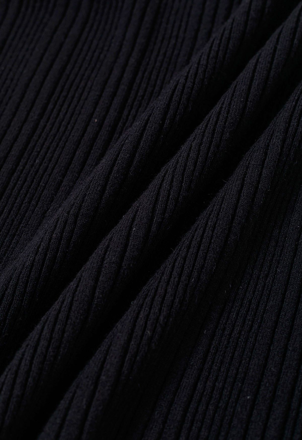 Haut en tricot côtelé à poignets évasés orné de perles en noir