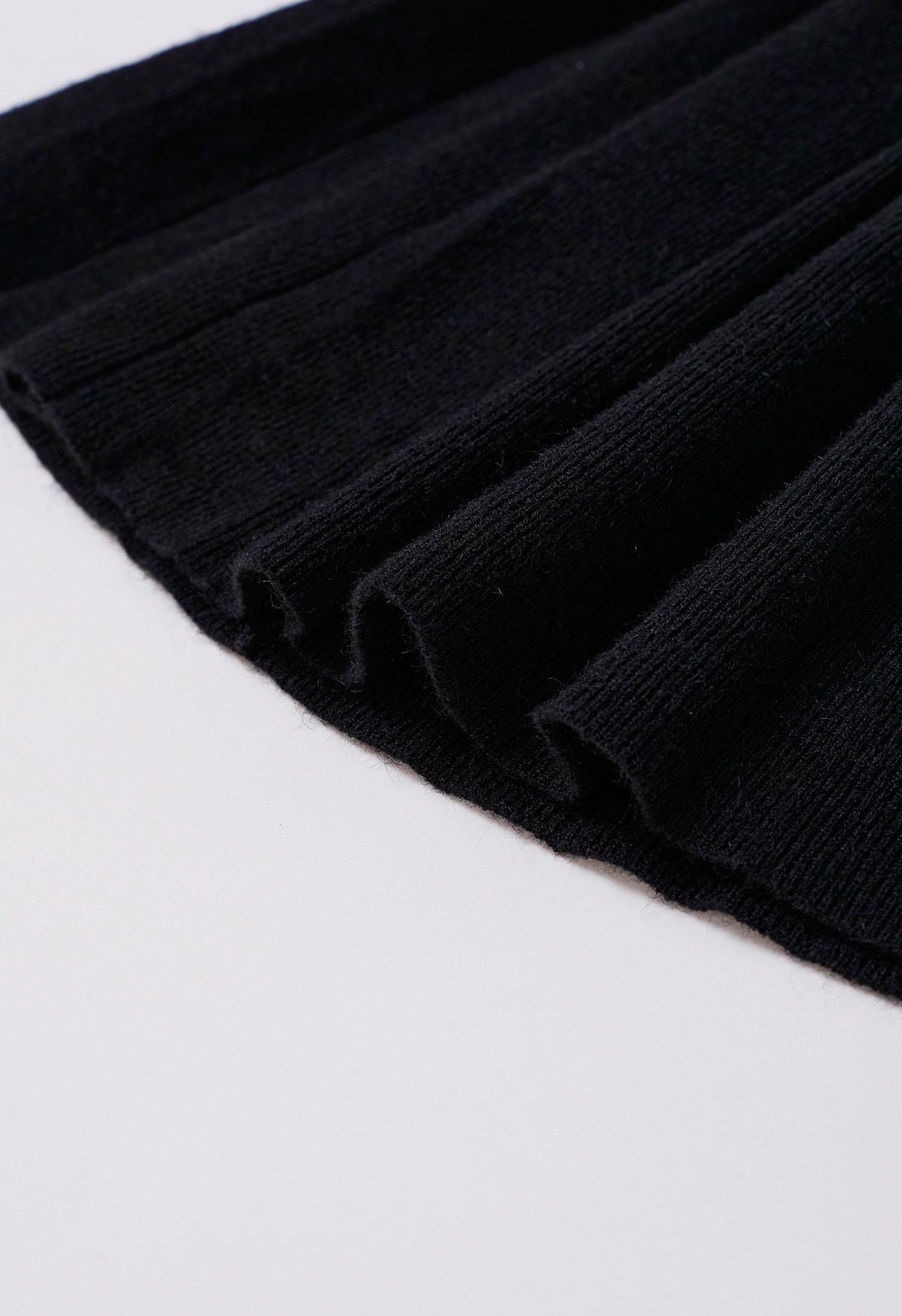 Mini-jupe plissée à taille élastique en noir