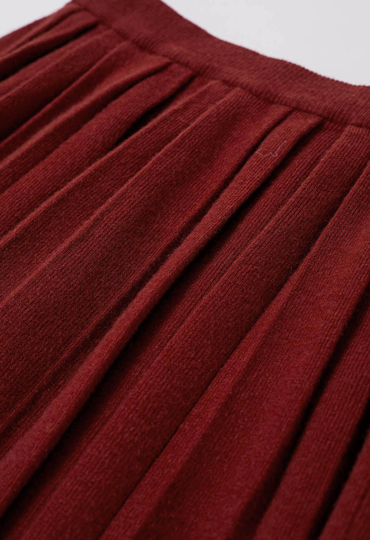 Mini-jupe plissée à taille élastique en rouge