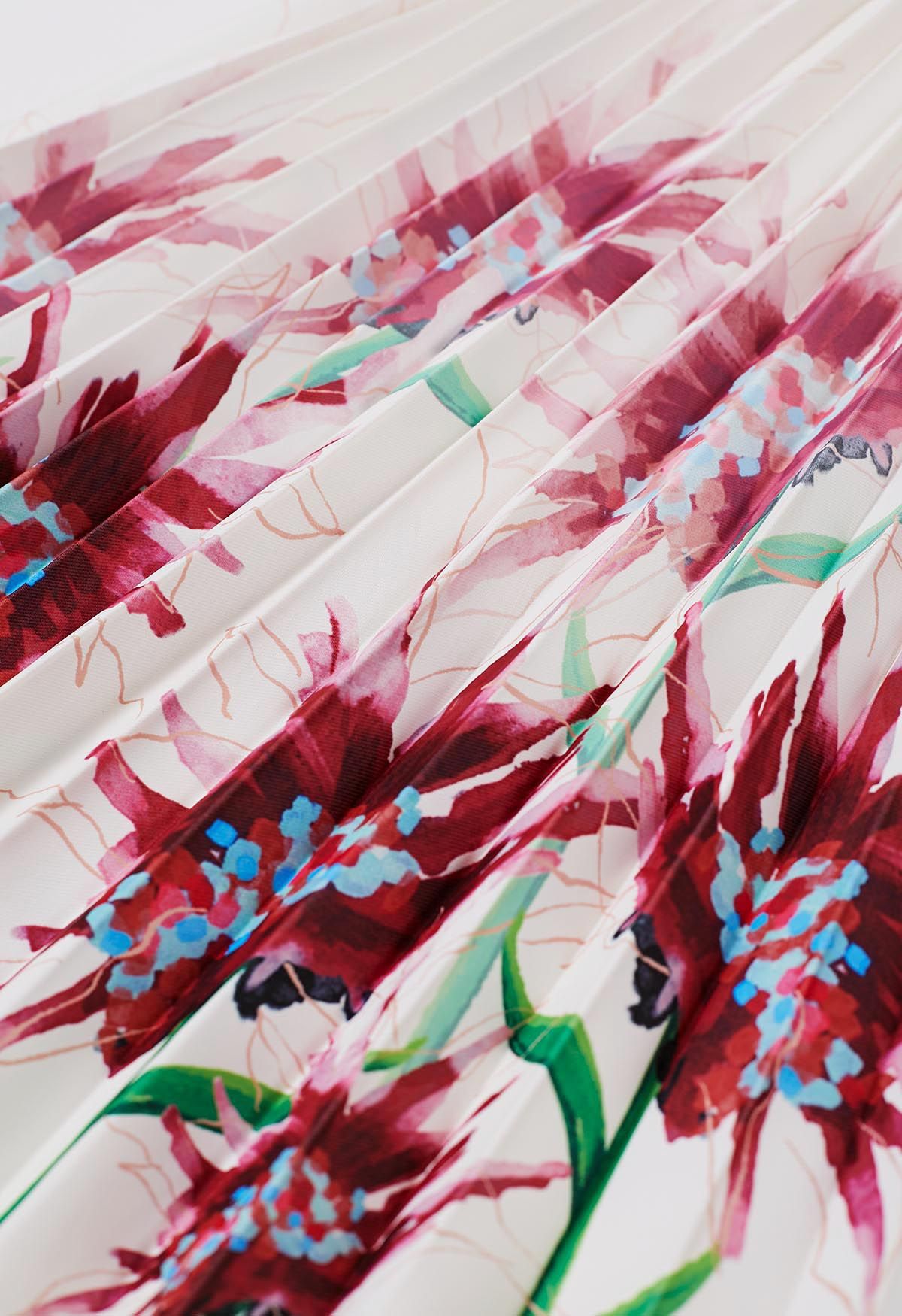 Jupe mi-longue plissée à fleurs aquarelle en bordeaux