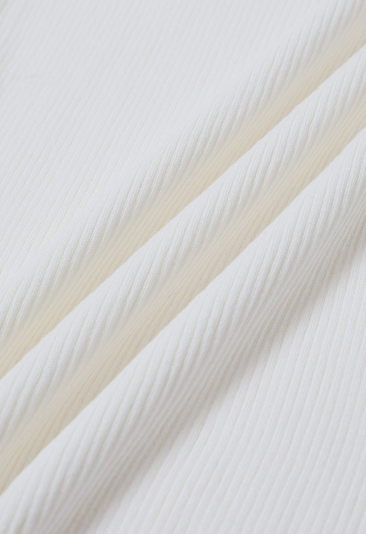 Haut en tricot épissé à manches en maille Floret 3D en blanc