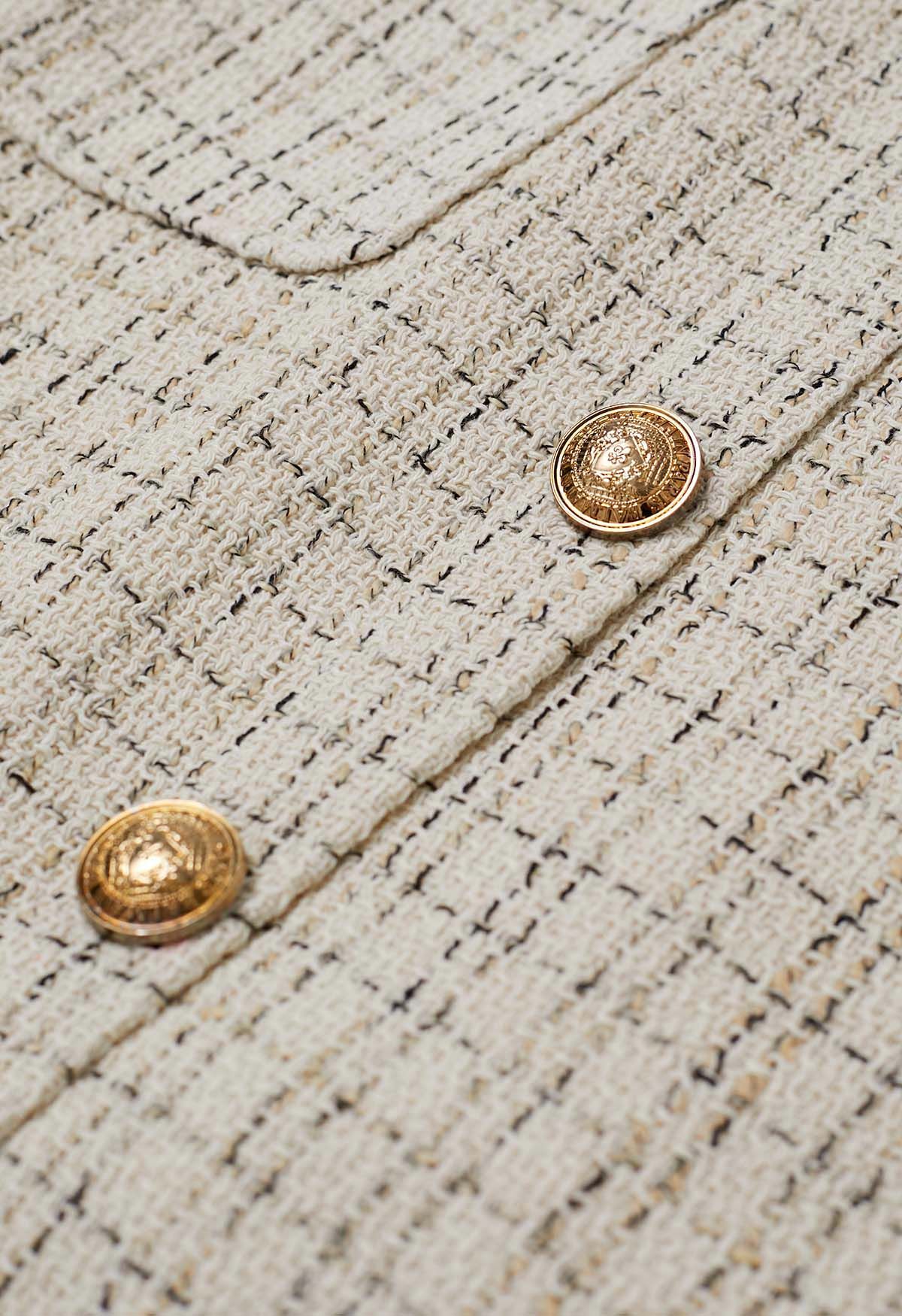Mini-jupe en tweed à carreaux avec poche boutonnée dorée