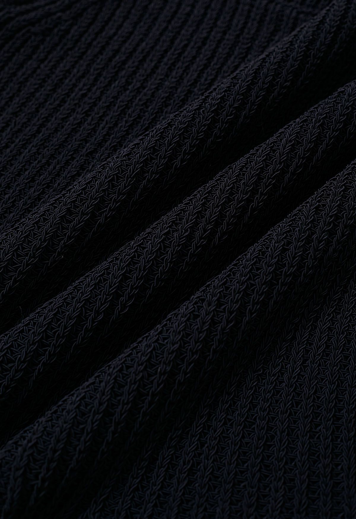 Haut en tricot sans manches à col rond et ourlet volanté en noir