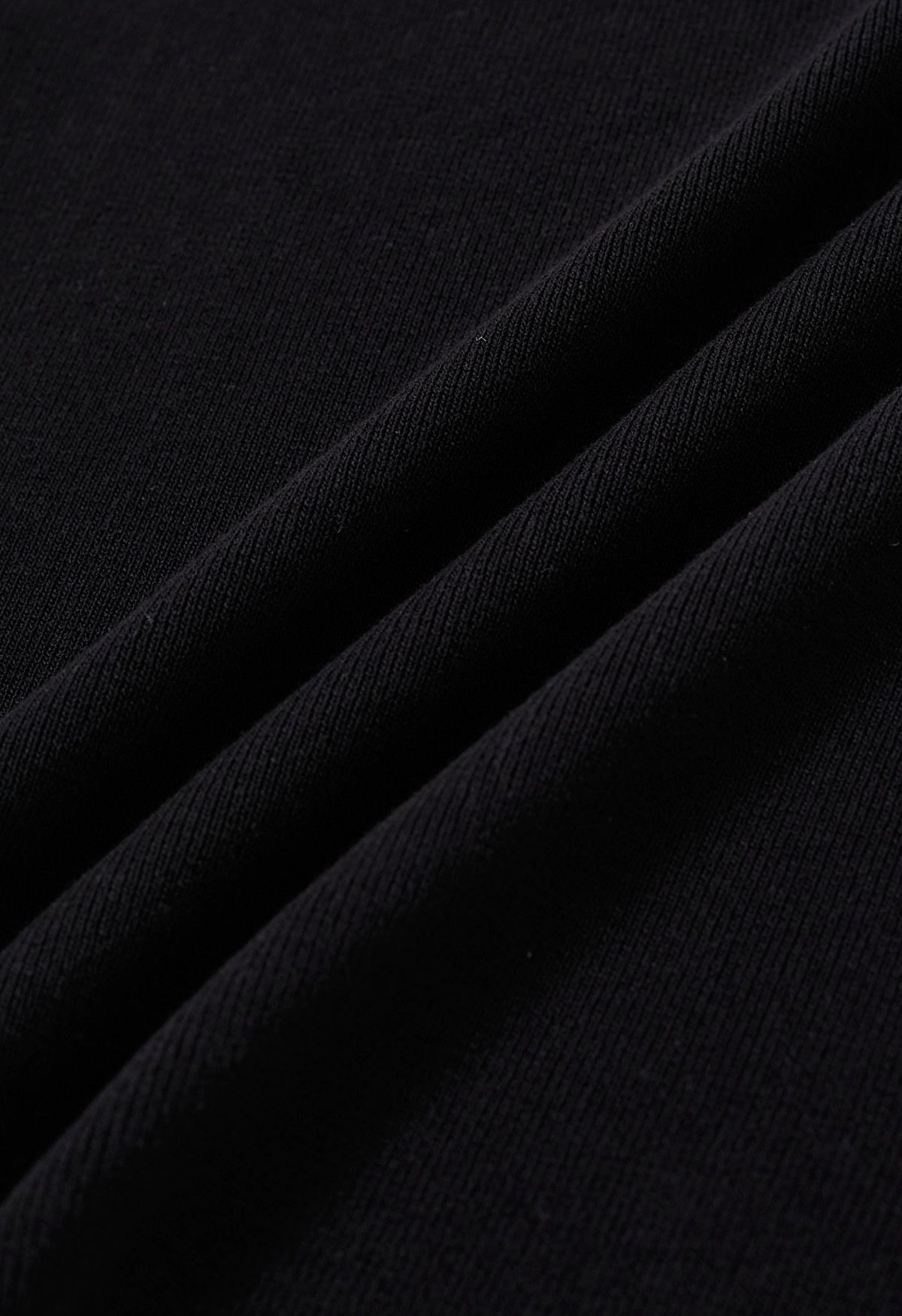 Haut en tricot à manches courtes et col ras du cou en noir