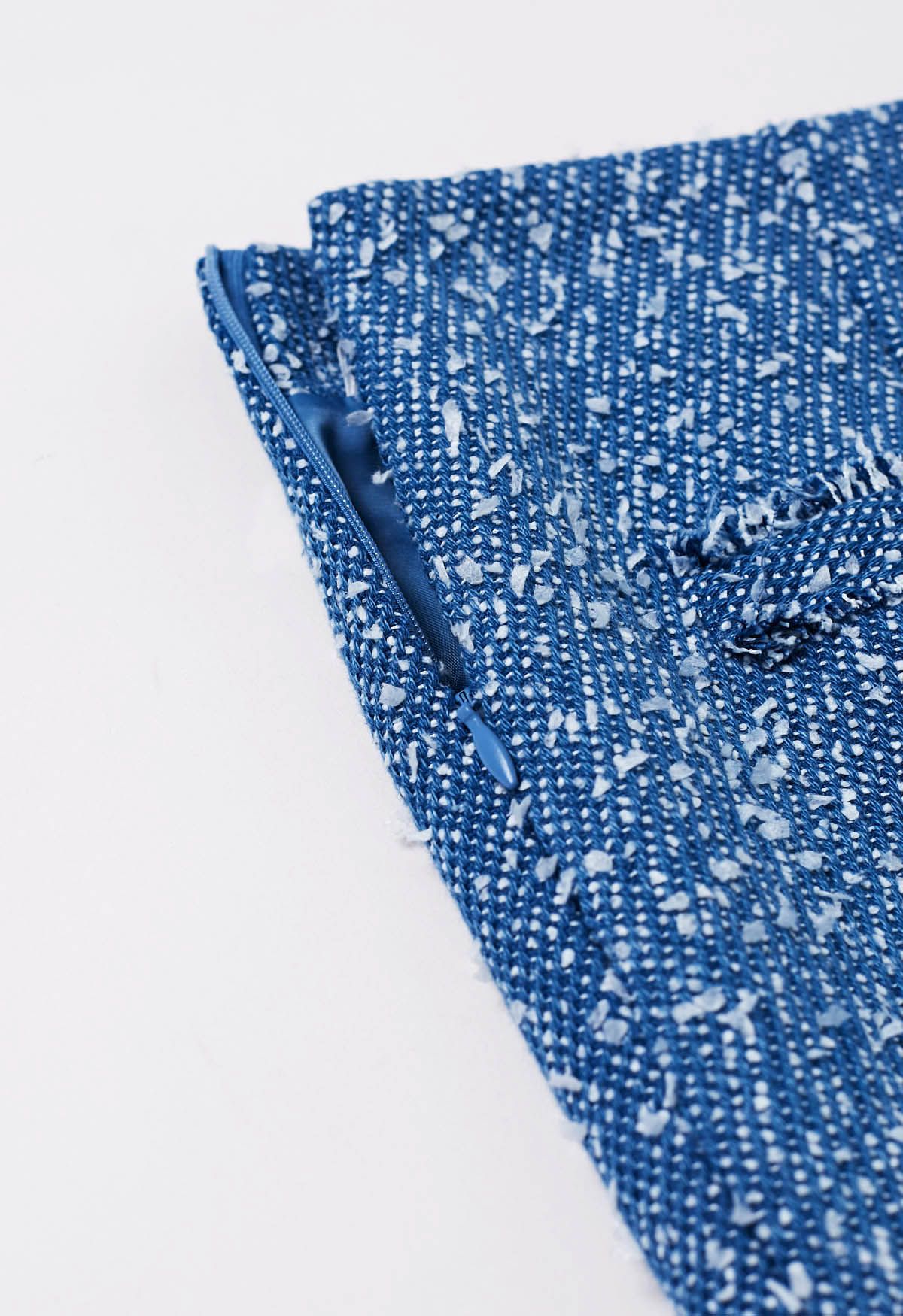 Mini-jupe en tweed boutonnée de couleurs mélangées en bleu