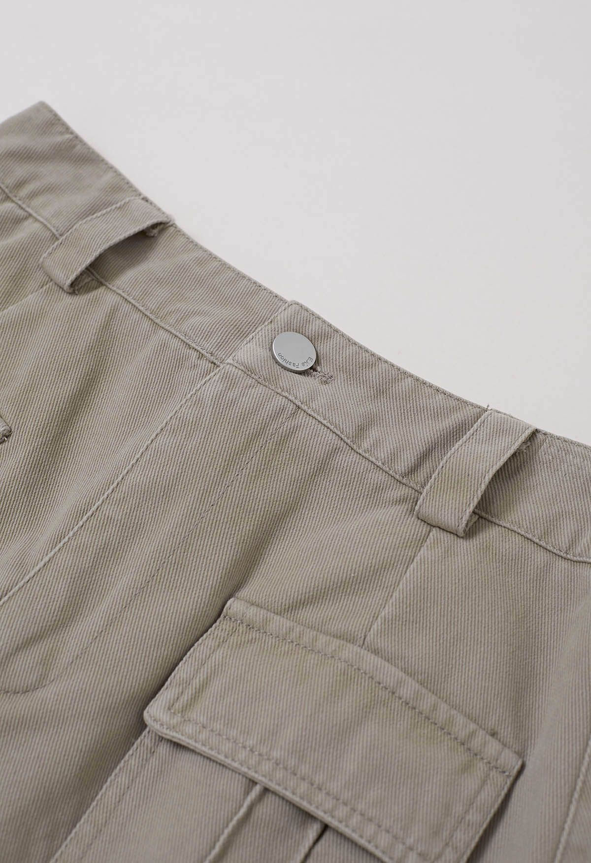 Mini-jupe en jean avec poche à rabat et ceinture en lin
