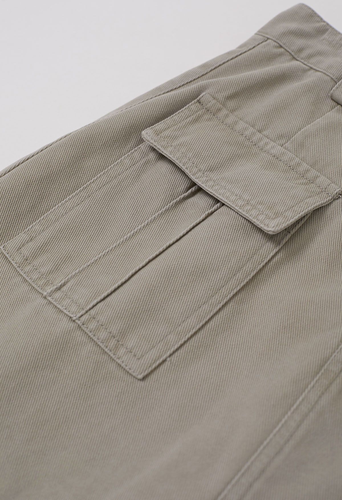 Mini-jupe en jean avec poche à rabat et ceinture en lin