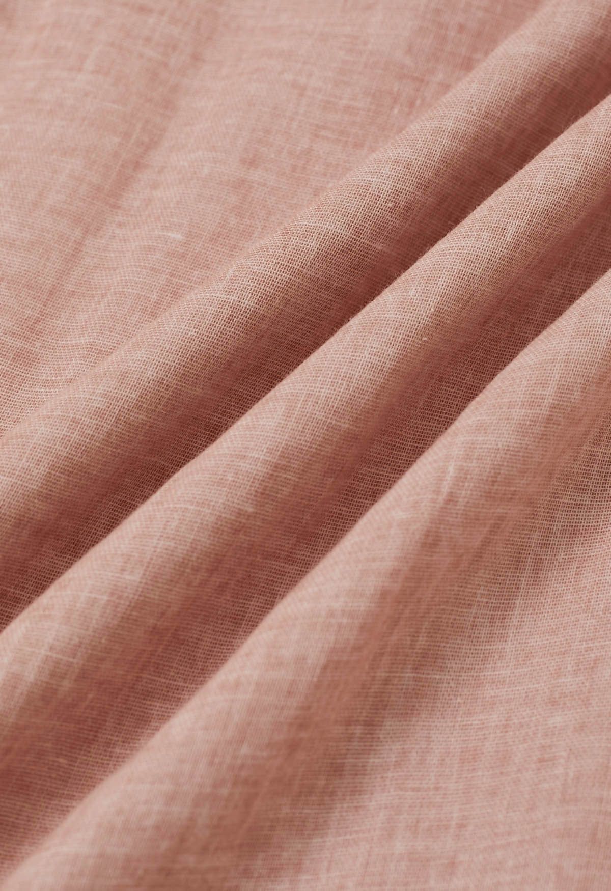 Robe dos nu à col noué et perles en rose