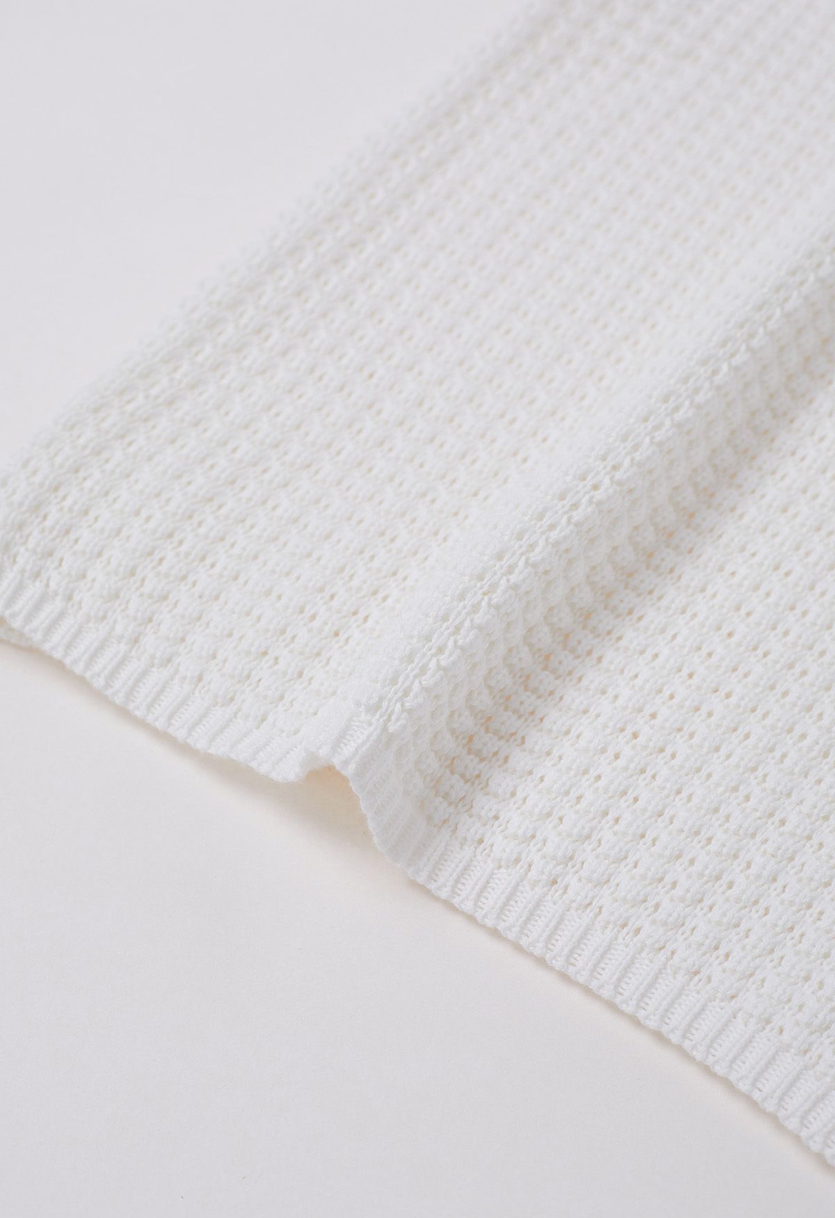 Haut sans manches en tricot ajouré de couleur unie en blanc