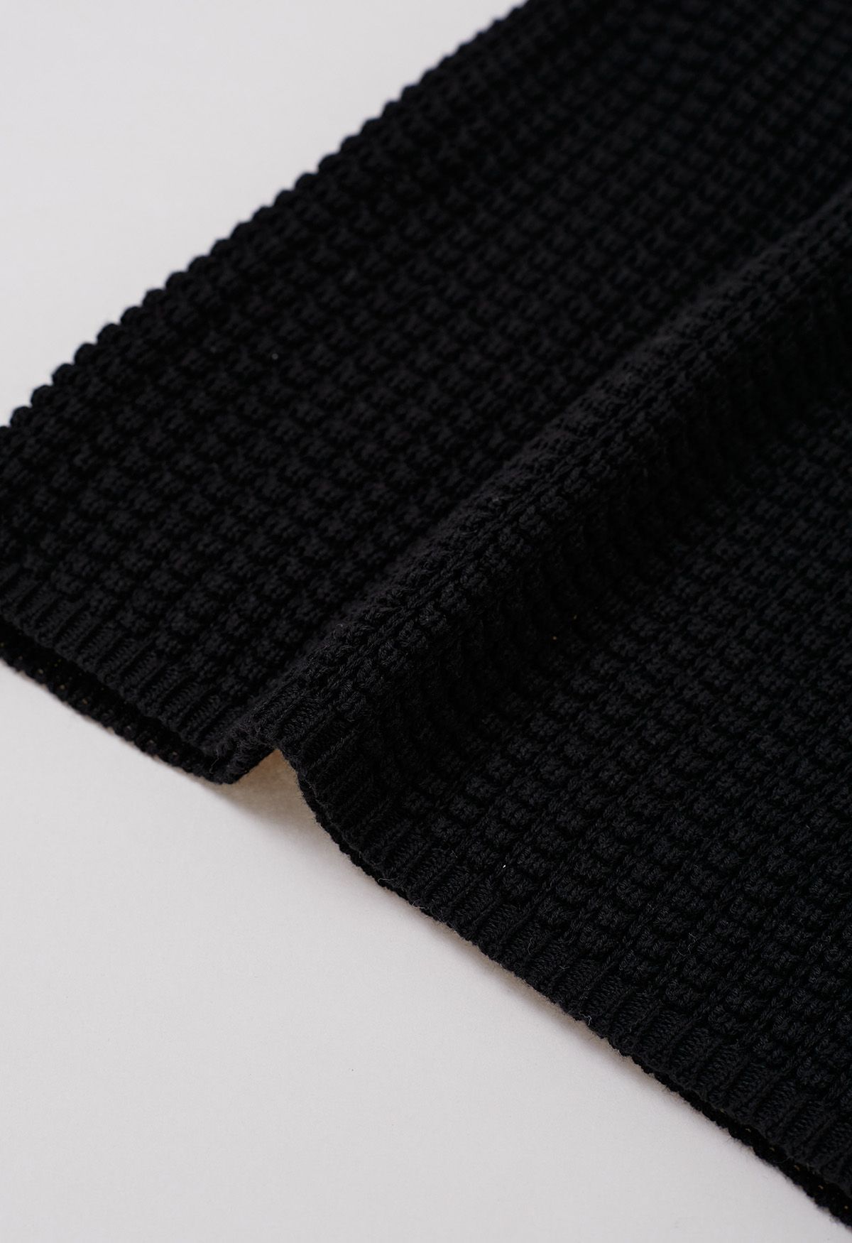 Haut sans manches en tricot ajouré de couleur unie en noir