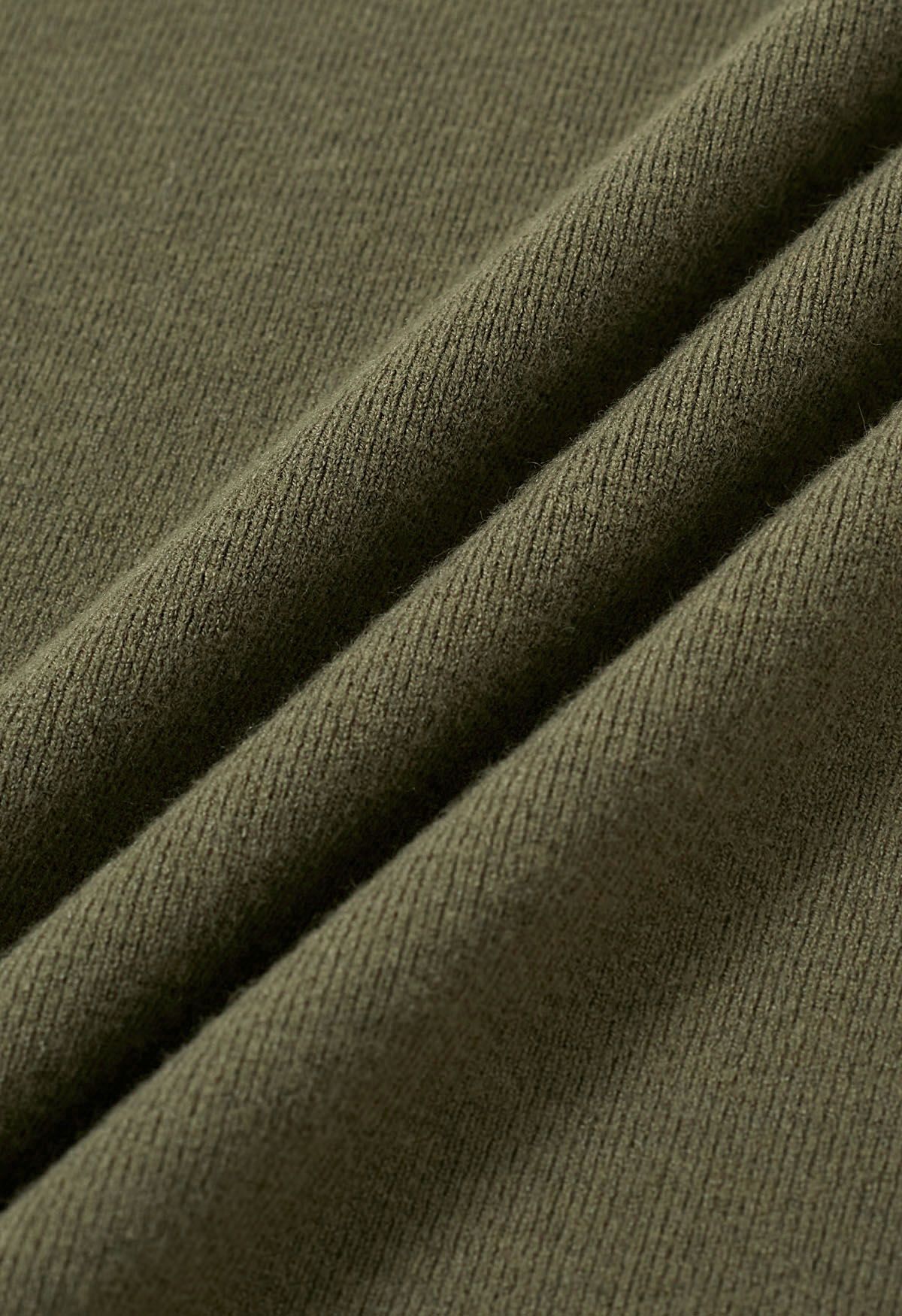 Haut en tricot à manches coudées et col montant en olive