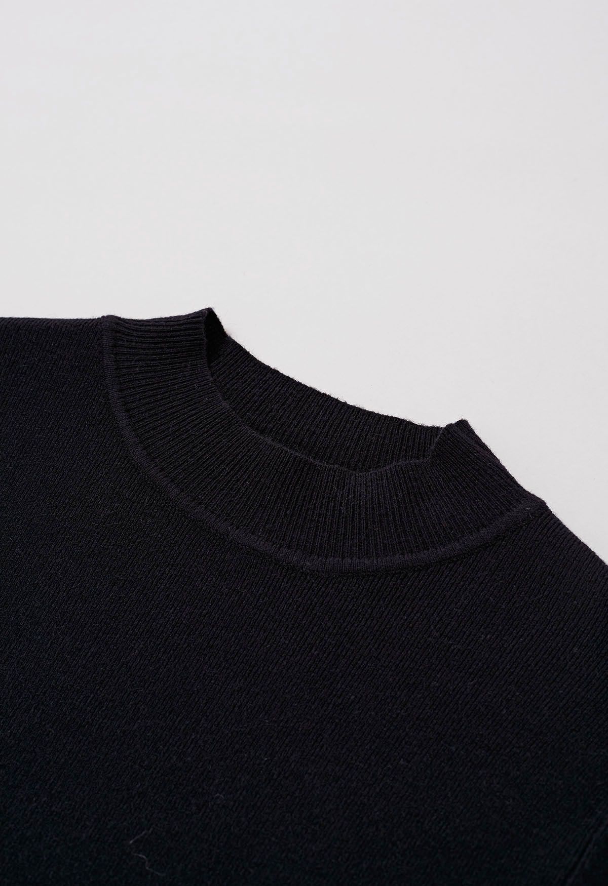 Haut en tricot à col montant et manches aux coudes en noir