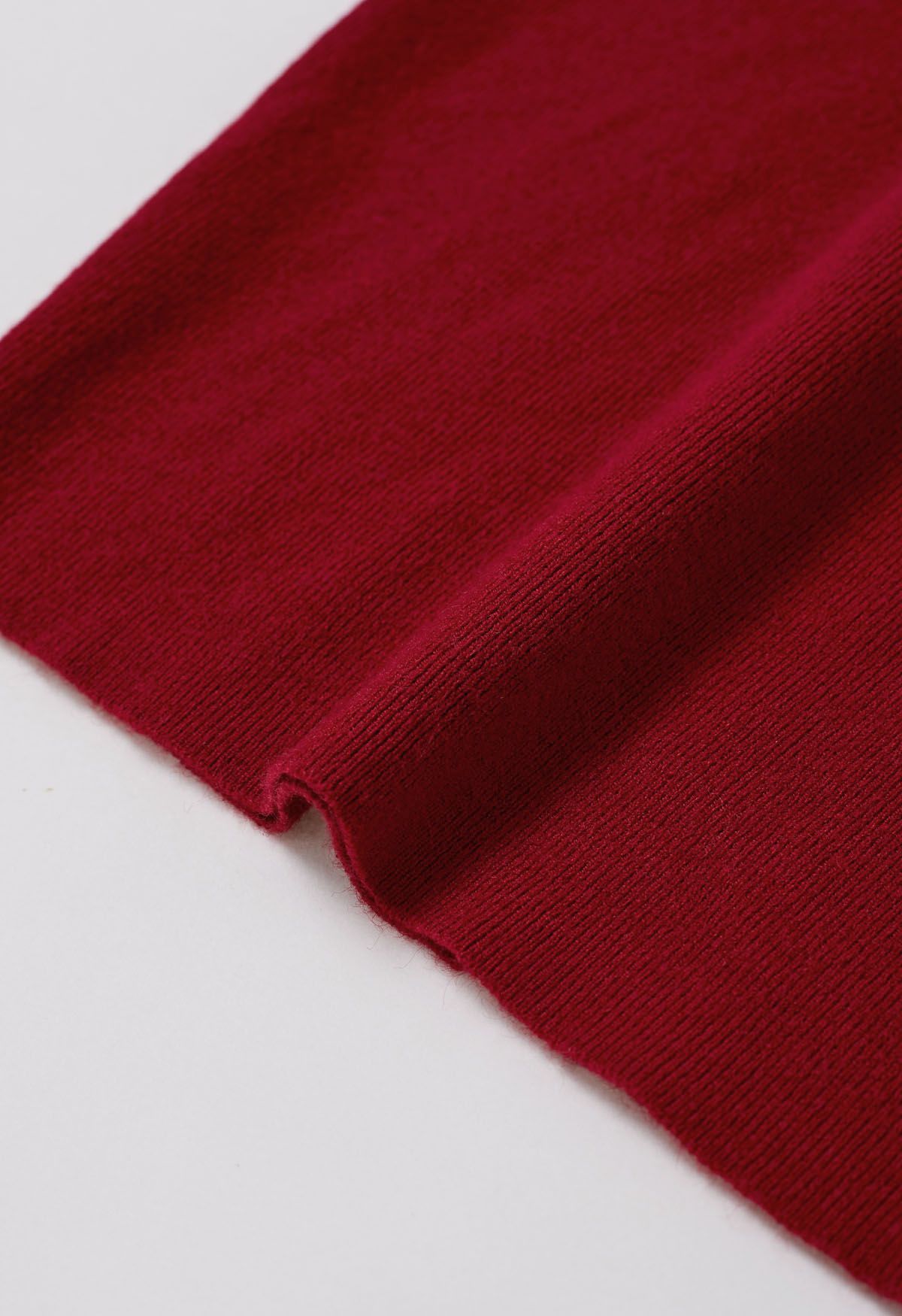 Haut en tricot à col montant et manches aux coudes en rouge