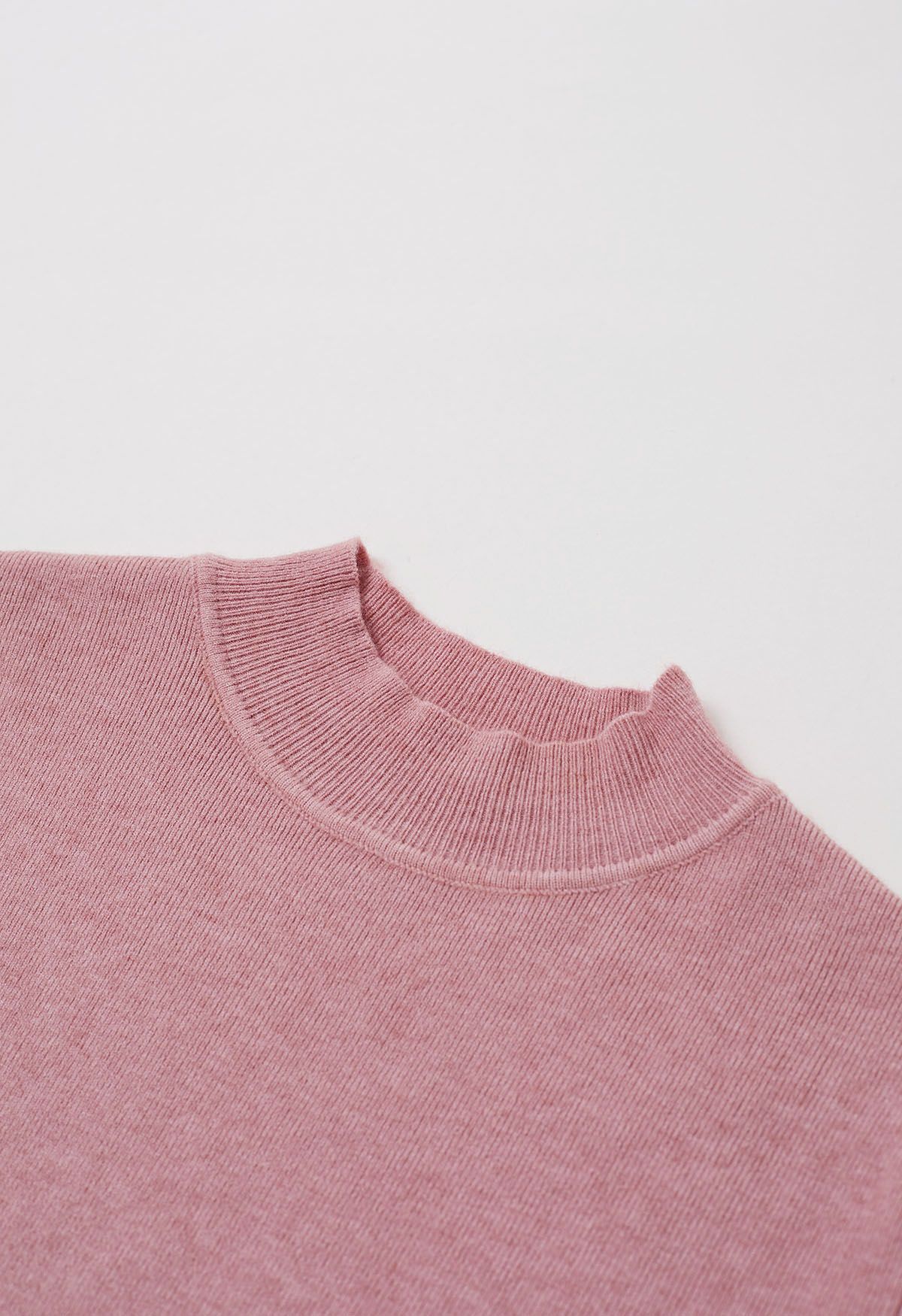 Haut en tricot à col montant et manches aux coudes en rose