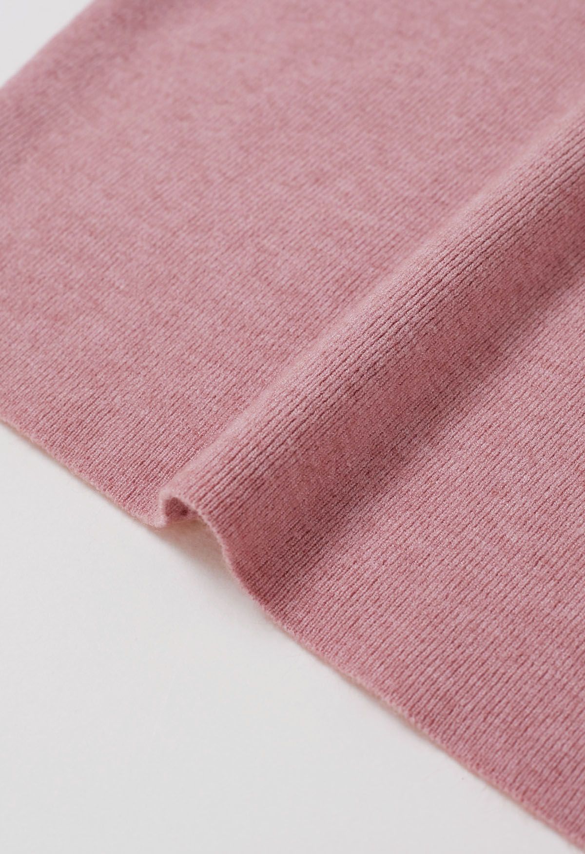 Haut en tricot à col montant et manches aux coudes en rose