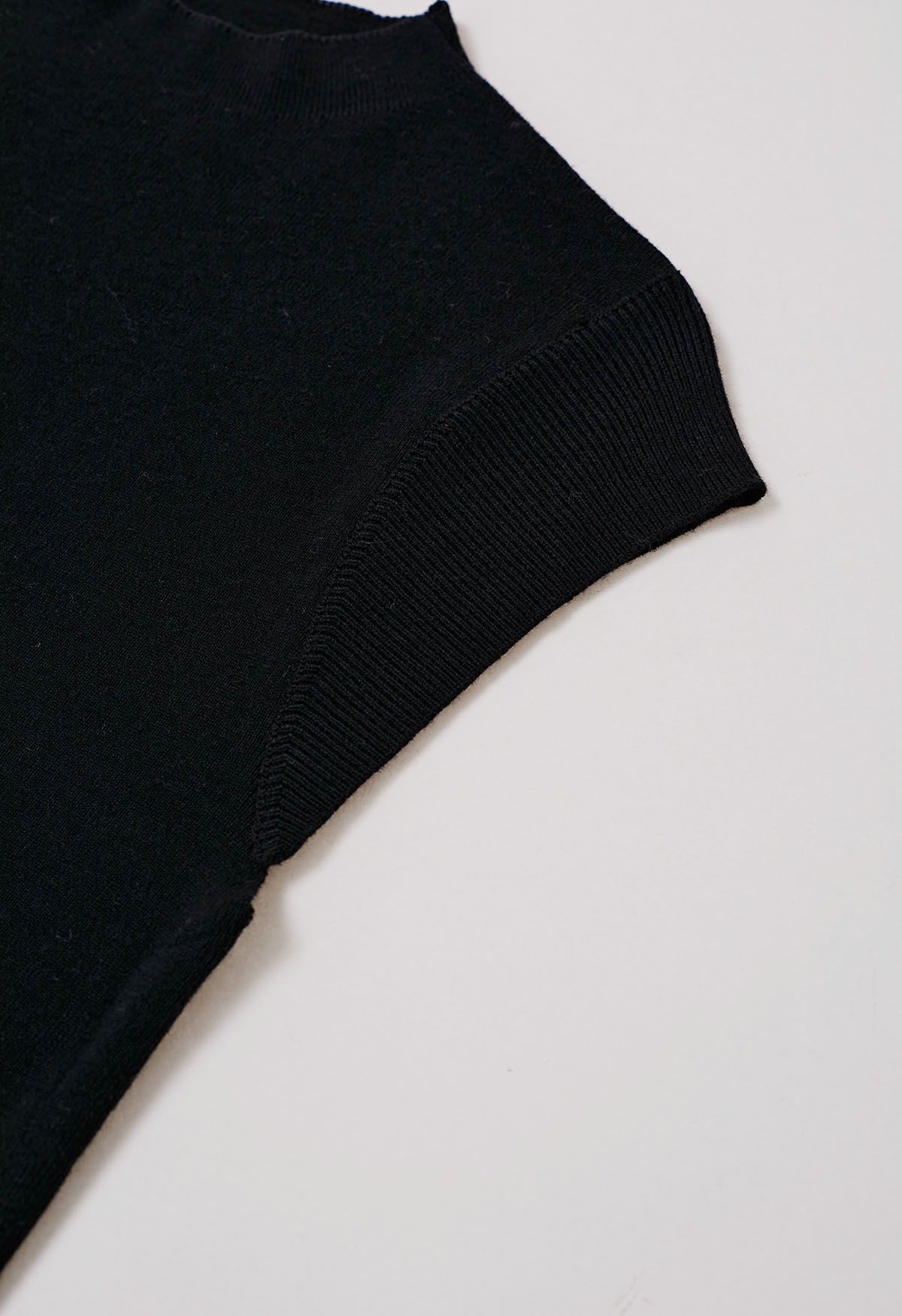 Haut en tricot à col montant avec cordon de serrage au dos en noir
