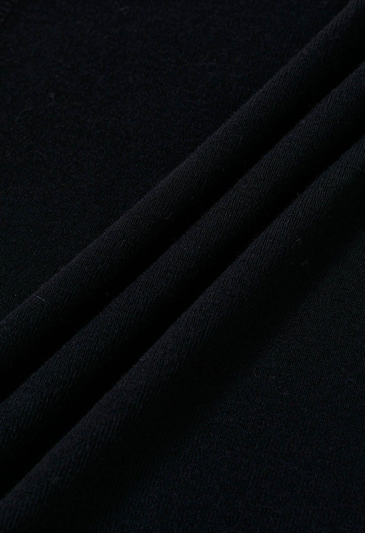 Haut en tricot à col montant avec cordon de serrage au dos en noir