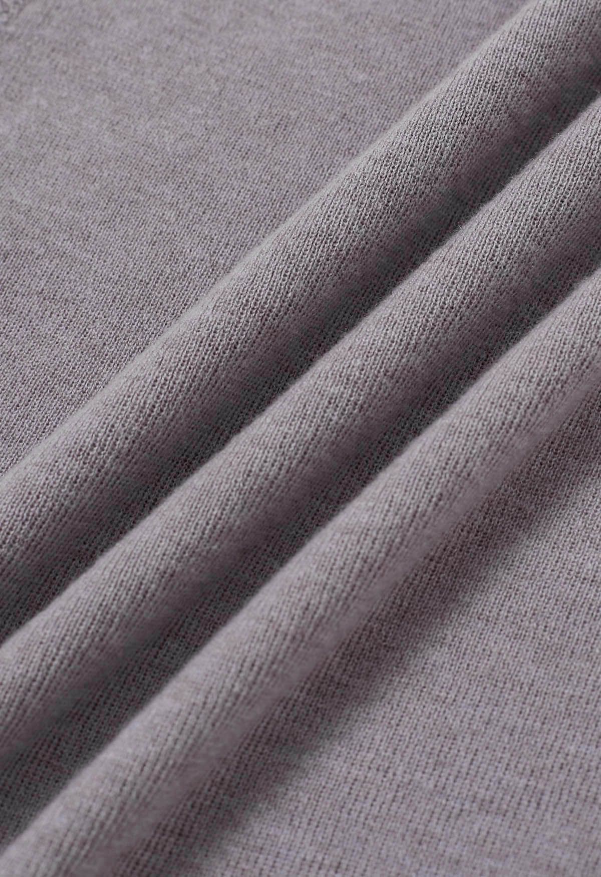 Haut en tricot à col montant avec cordon de serrage au dos en gris