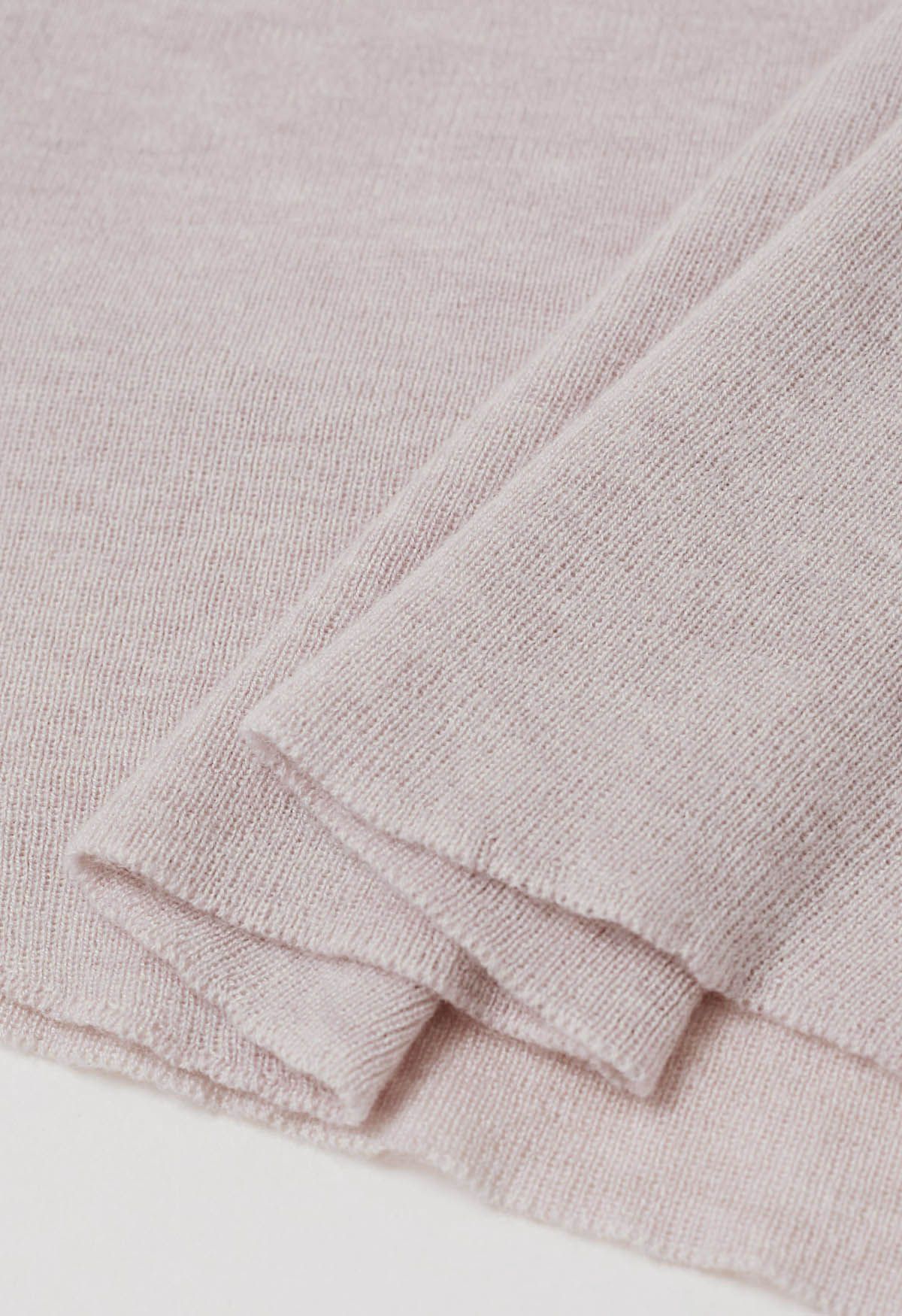 Haut en tricot à col montant avec cordon de serrage au dos en rose