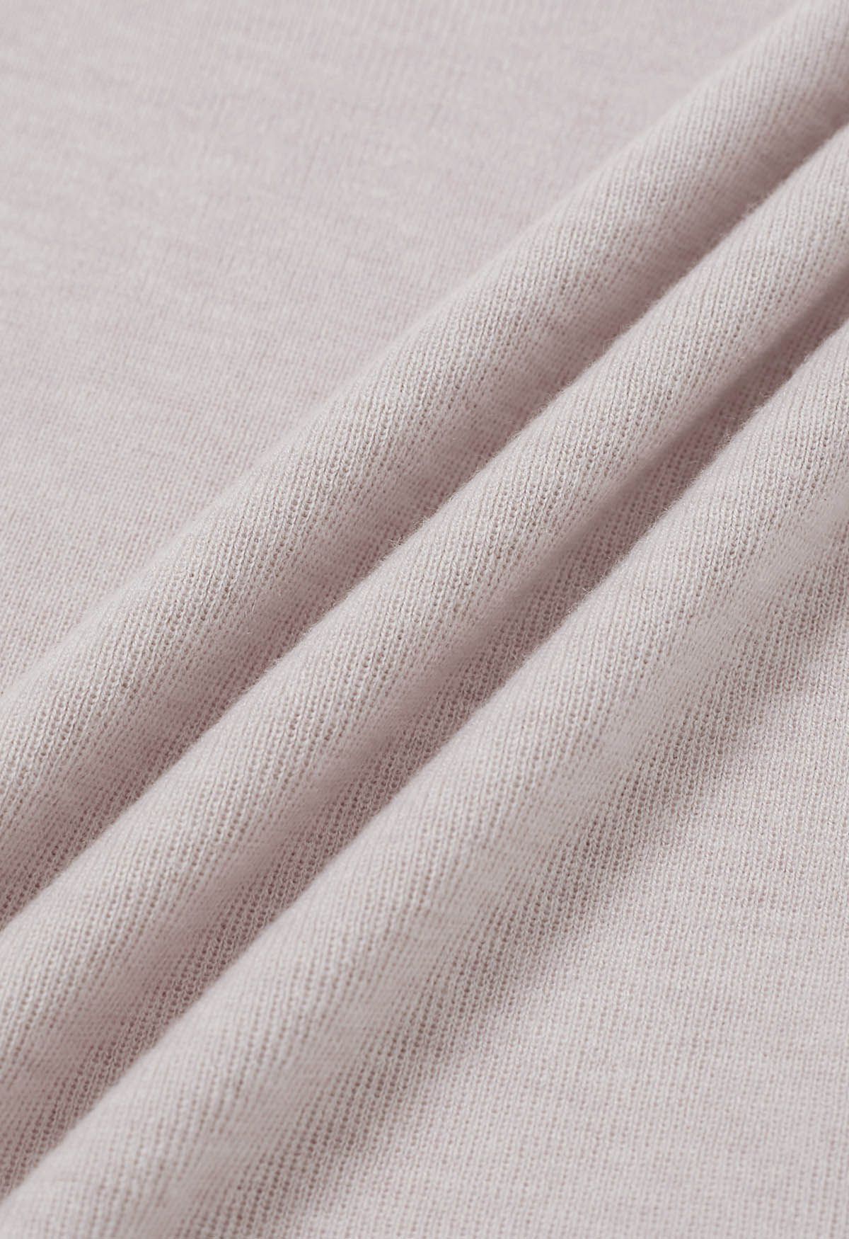 Haut en tricot à col montant avec cordon de serrage au dos en rose