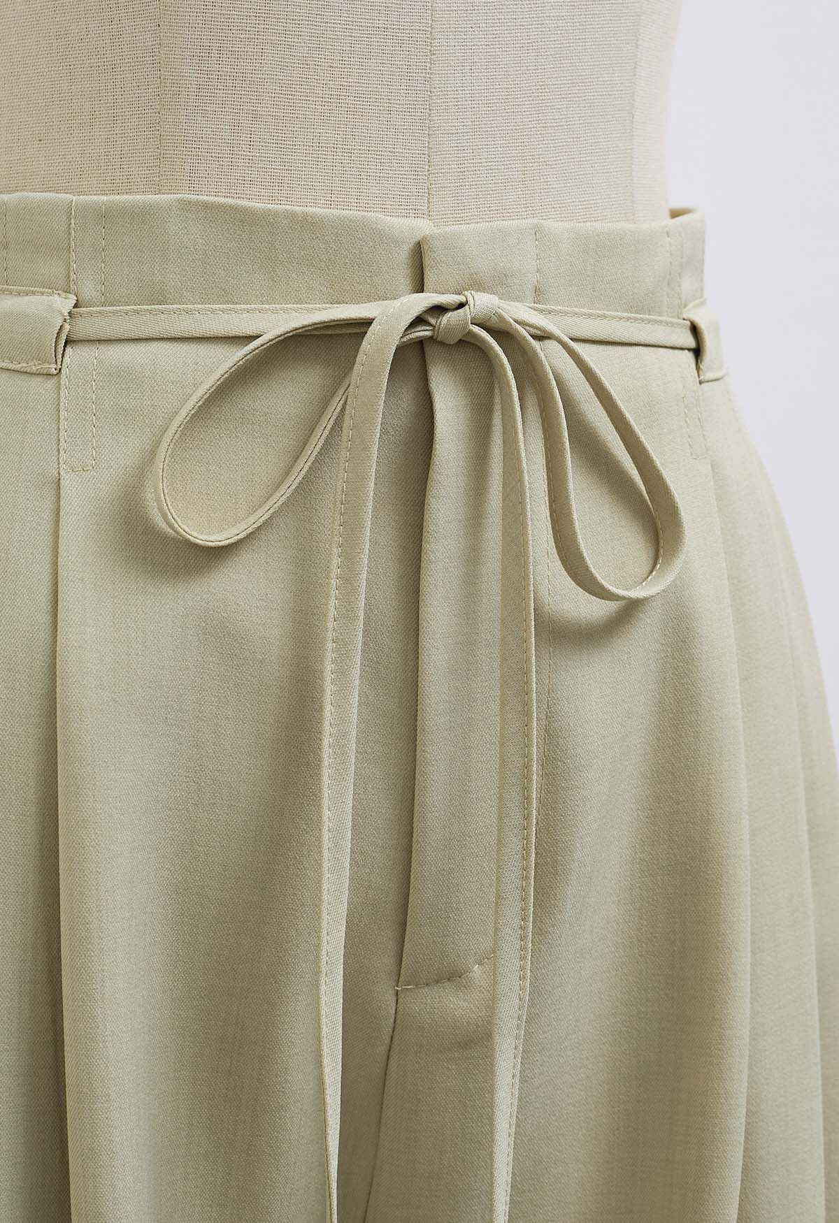 Pantalon large à plis et cordons à nouer, vert pois