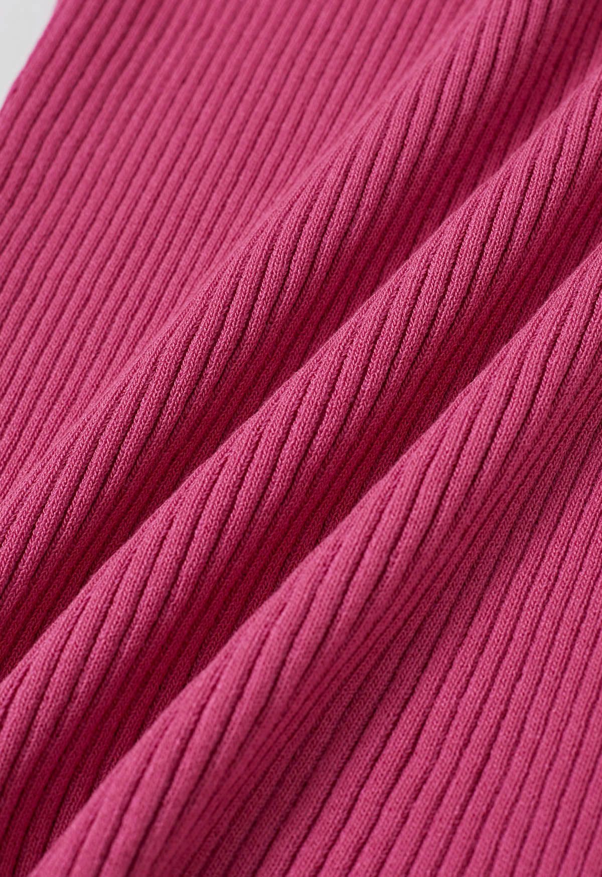 Haut en tricot dos nu à décor de perles en bois en rose vif