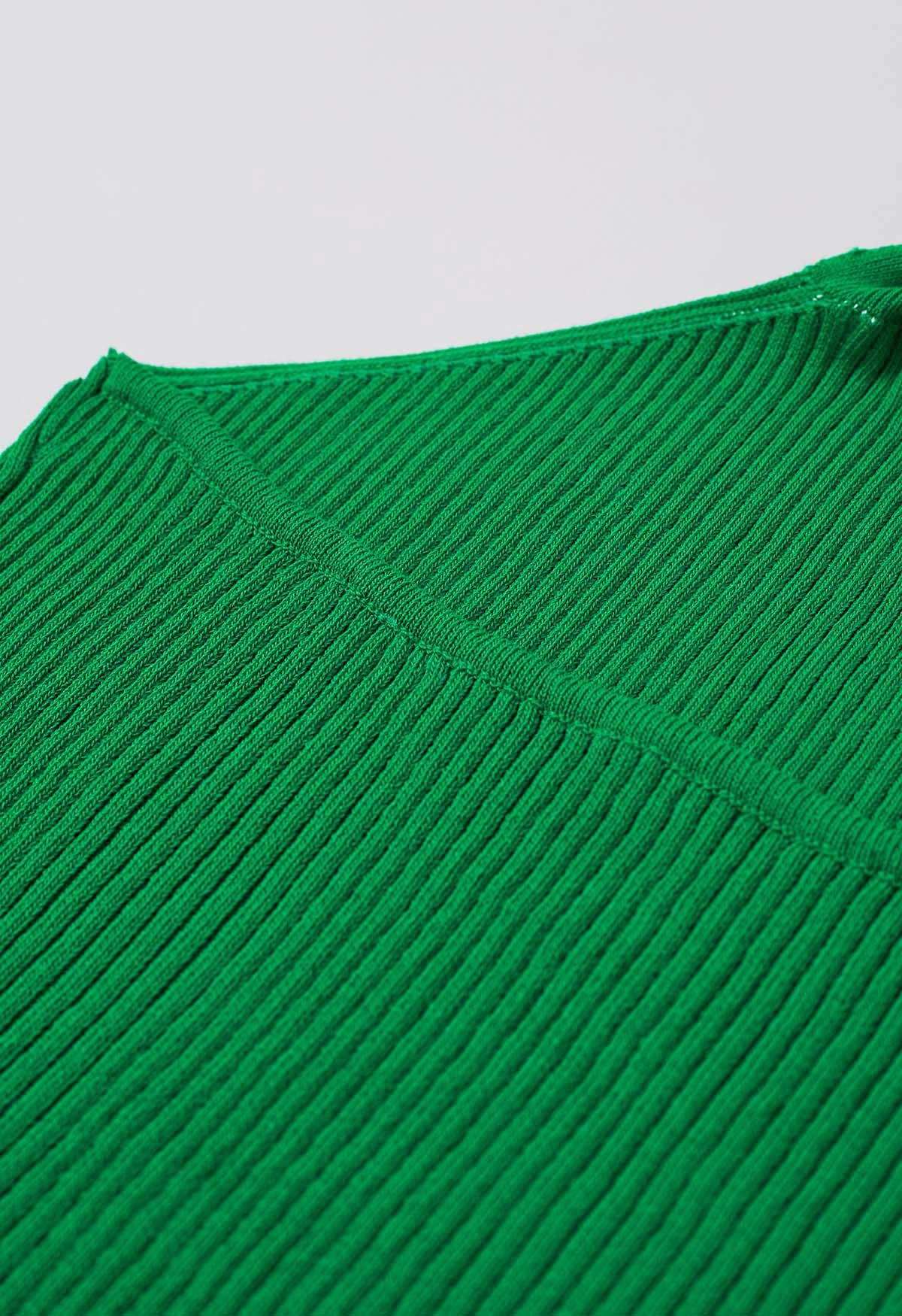 Haut en tricot dos nu à décor de perles en bois en vert