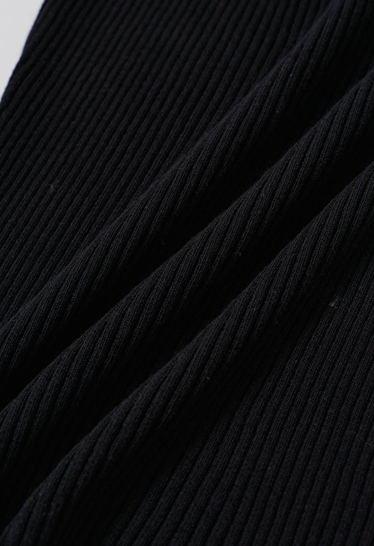 Haut en tricot dos nu à décor de perles en bois en noir