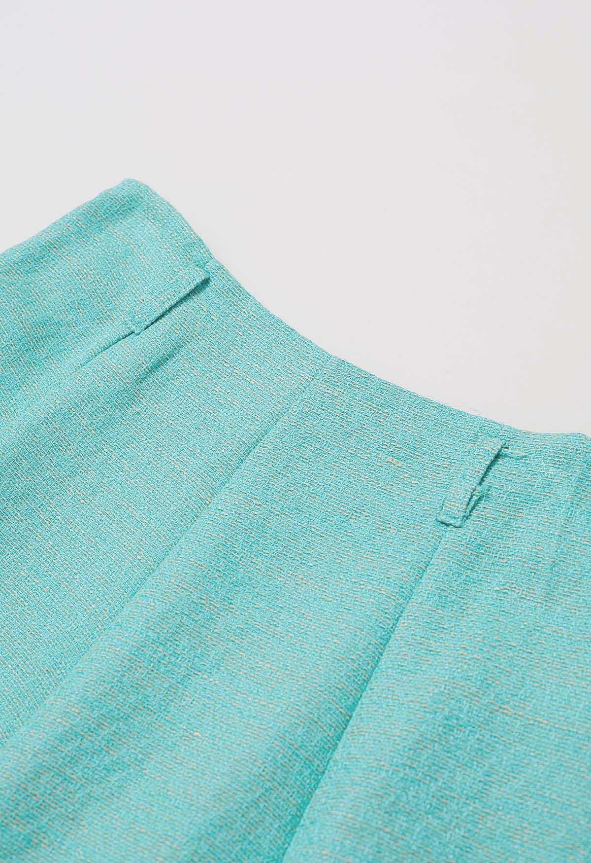 Jupe mi-longue trapèze ceinturée en tweed chatoyant en turquoise