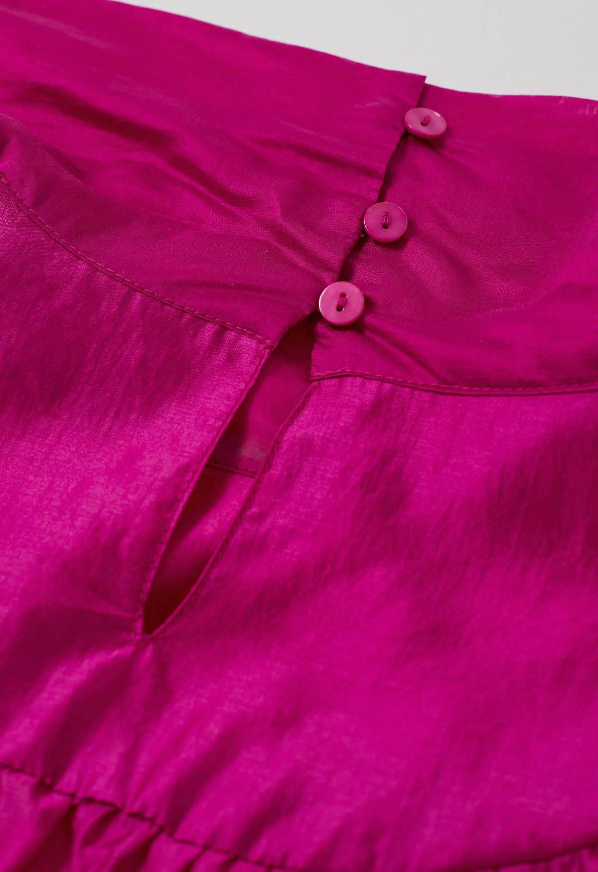 Charmante chemise transparente à manches bouffantes et nœud papillon en rose vif