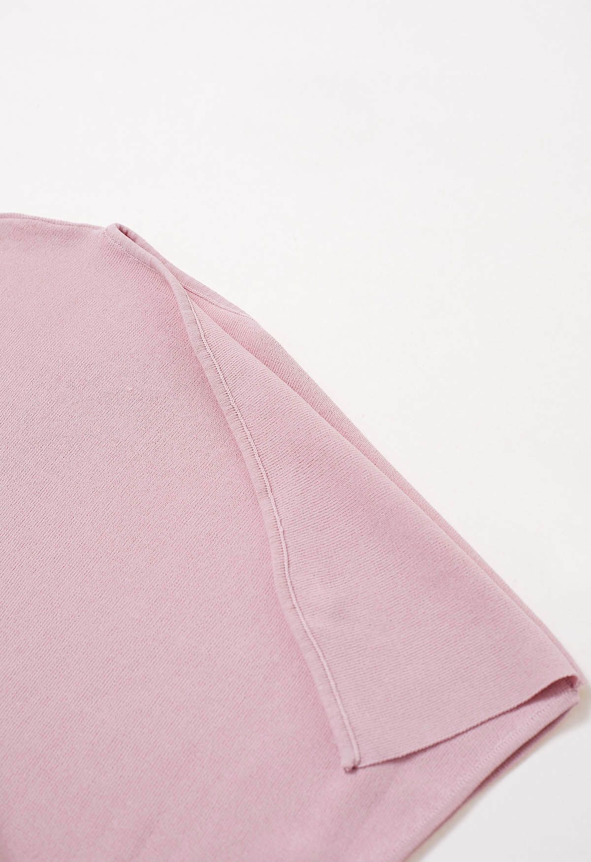 Haut en tricot asymétrique à col plié en rose