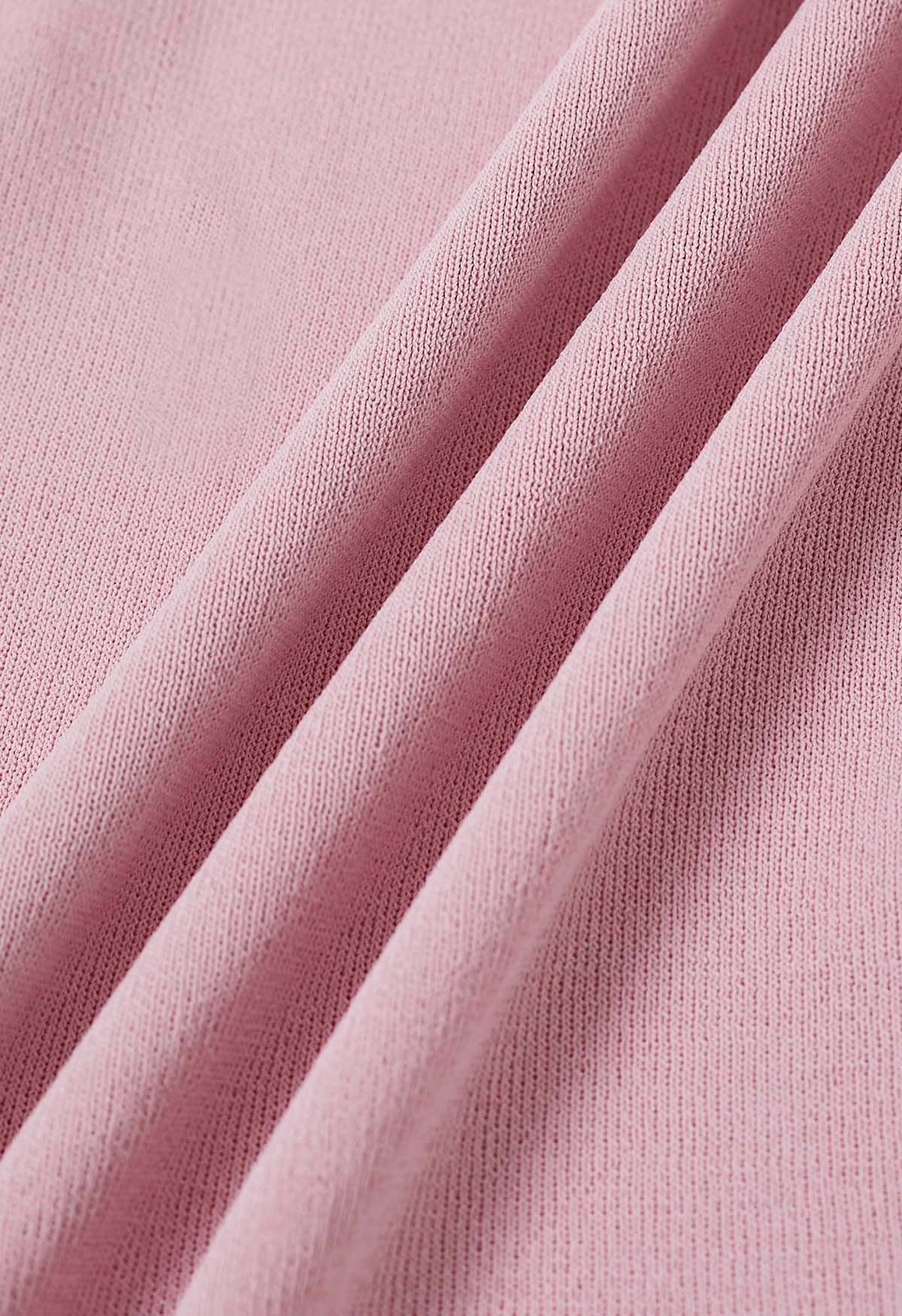 Haut en tricot asymétrique à col plié en rose