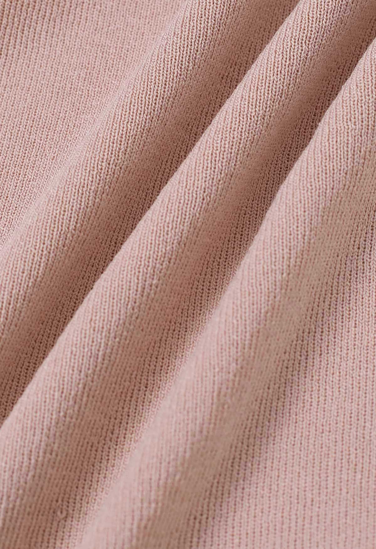 Haut en tricot sans manches froncé avec nœud latéral en rose