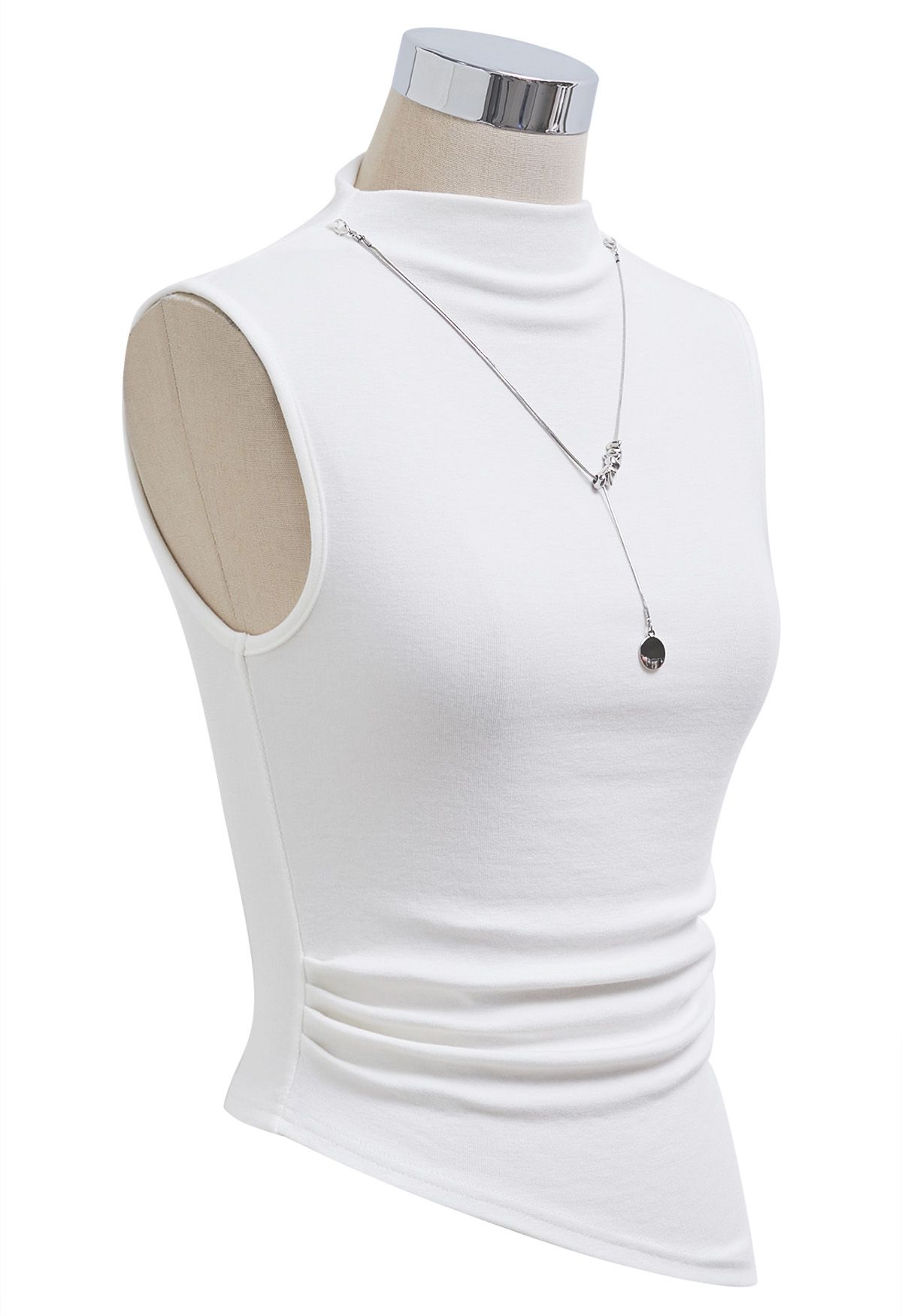 Haut asymétrique sans manches orné d'un collier détachable en blanc