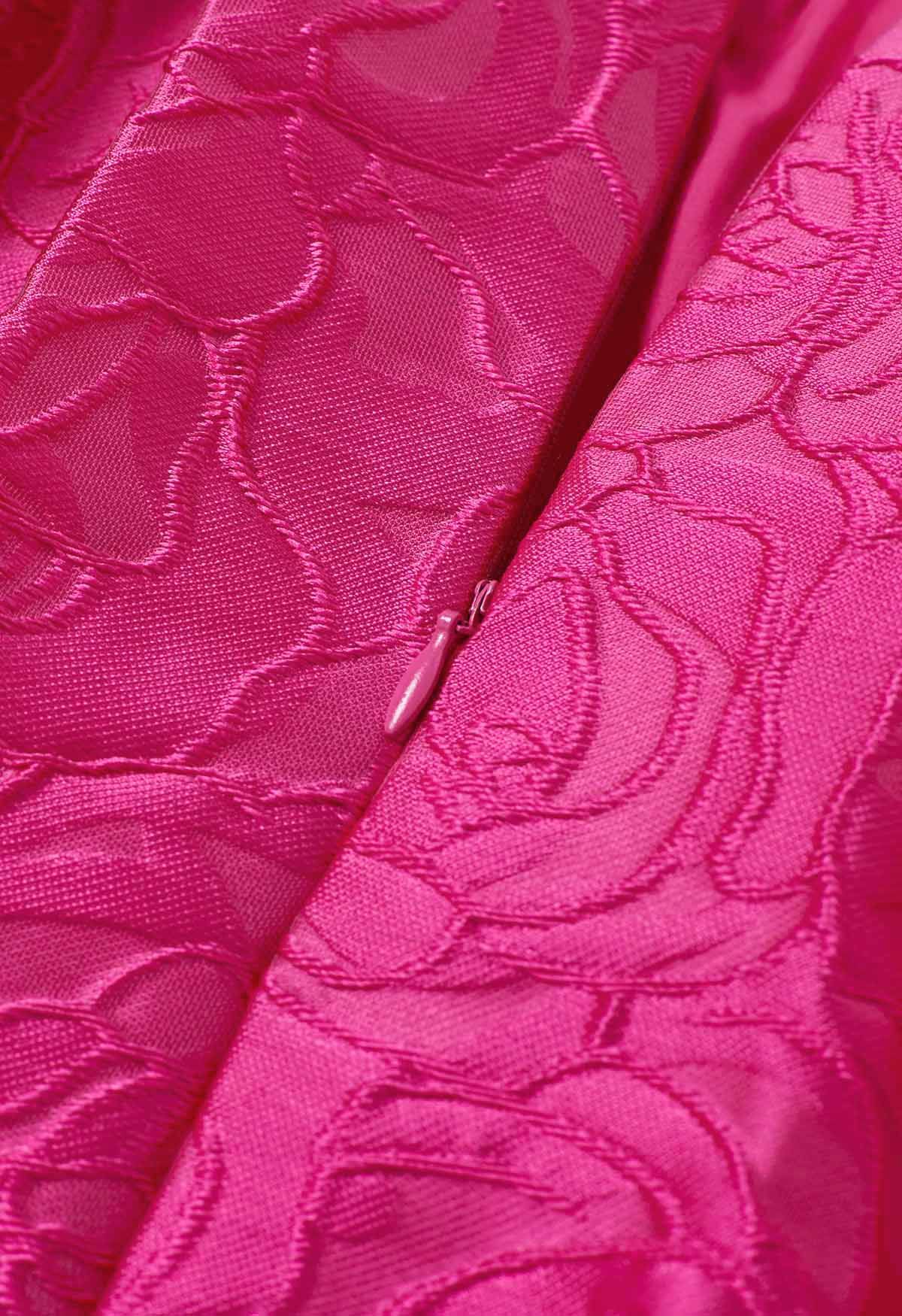 Jupe mi-longue plissée en jacquard à roses fuchsia avec poche latérale