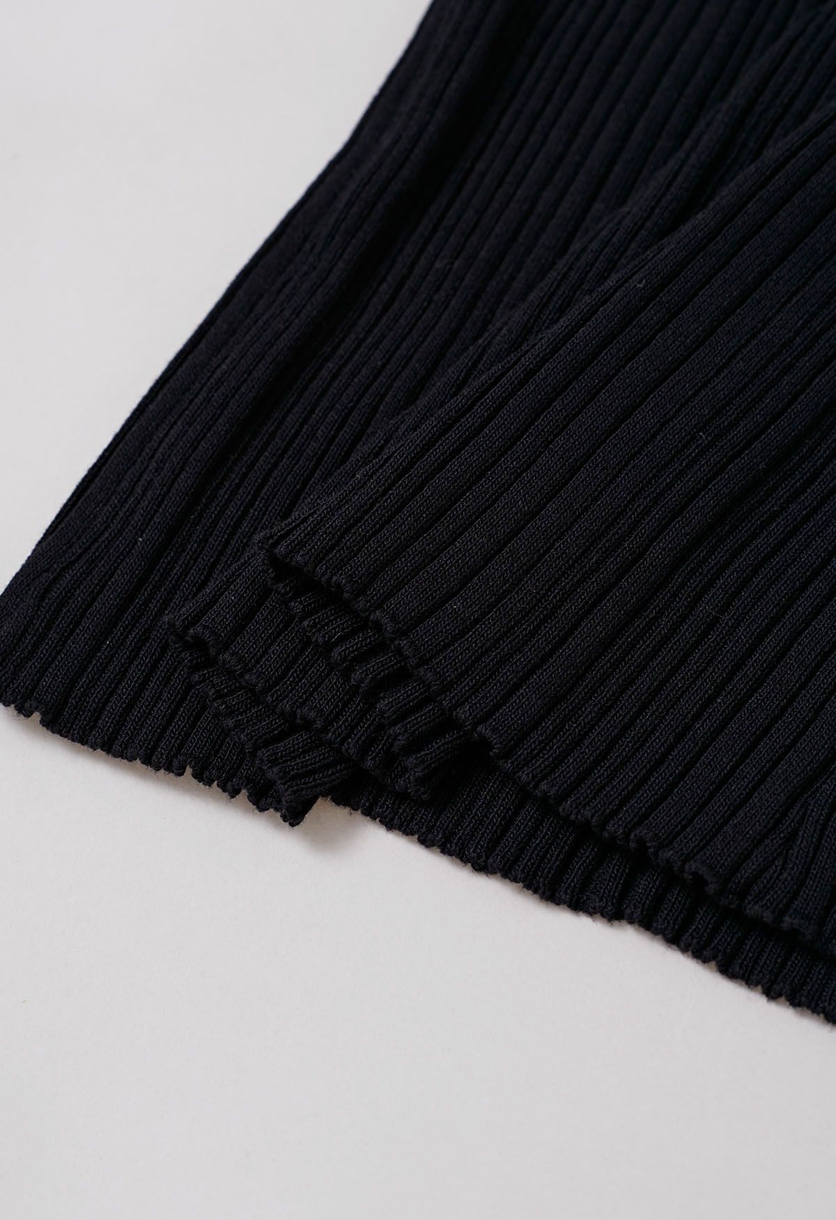 Haut en tricot sans manches à texture côtelée minimaliste en noir